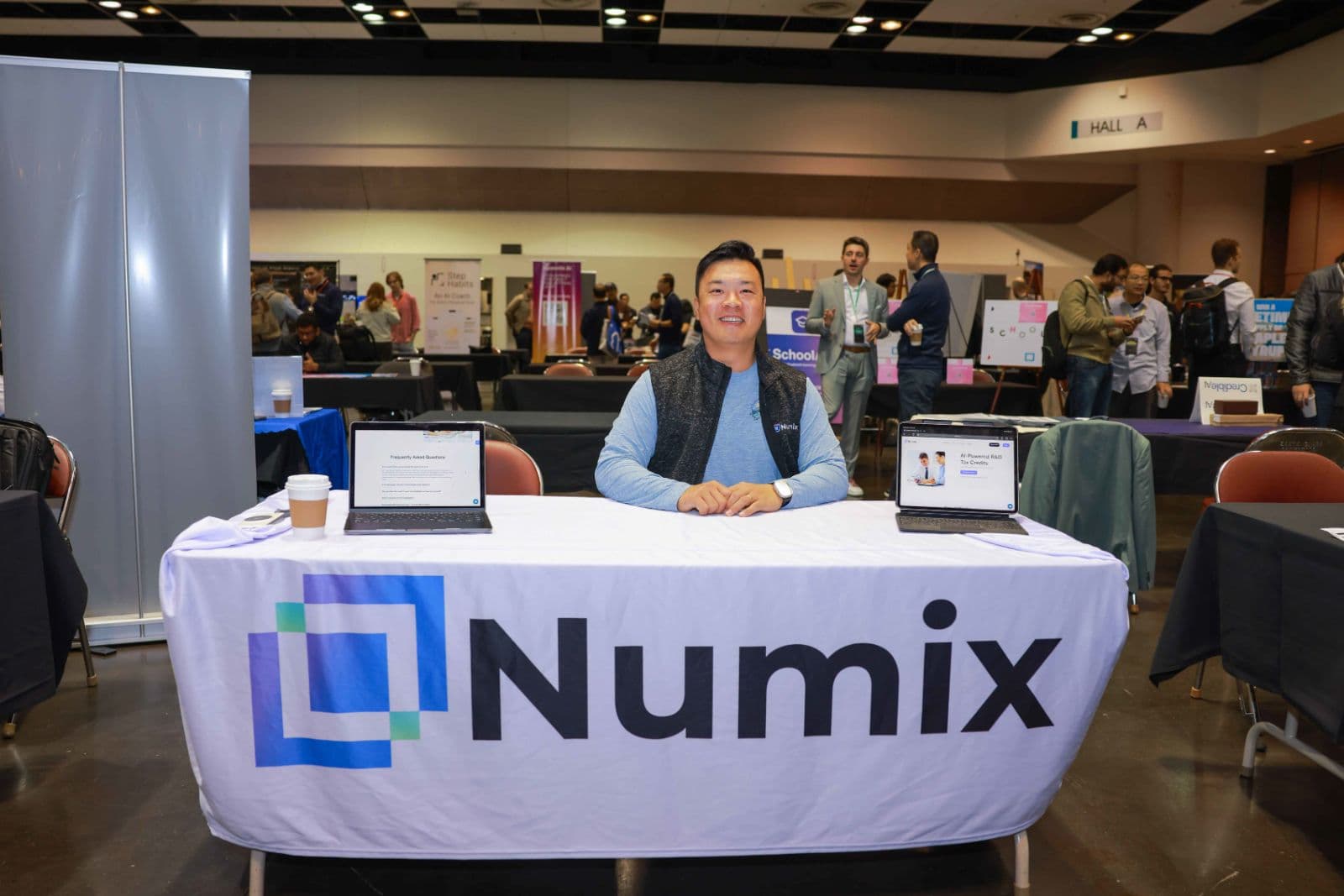 AI technology summit speaker presenting on stage in San Francisco by JY Studio