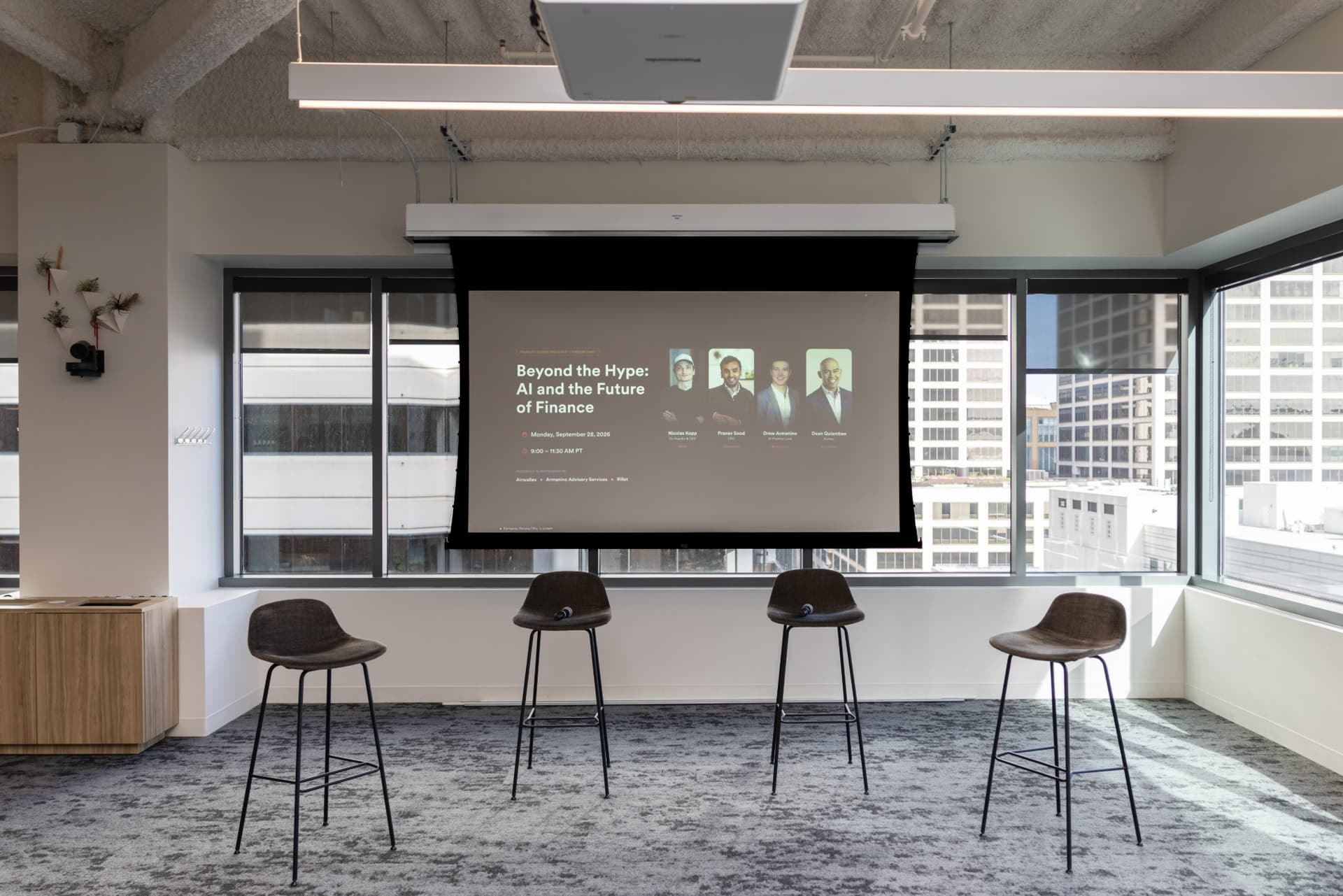 Four stools set in front of the Beyond the Hype title slide before the fireside chat at Airwallex's Beyond the Hype: AI and the Future of Finance breakfast fireside chat at the Airwallex San Francisco office by JY Studio