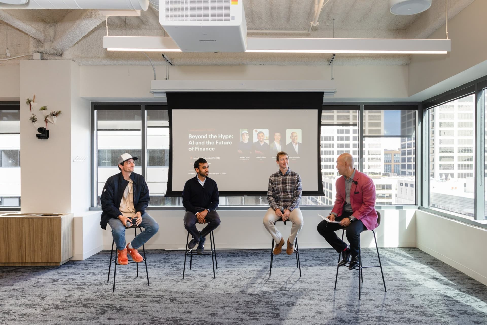 Panelists Nicolas Kopp, Co-founder and CEO of Rillet, Pranav Sood, CFO of Airwallex, Drew Armanino, and moderator Dean Quiambao seated on stage at Airwallex's Beyond the Hype: AI and the Future of Finance breakfast fireside chat at the Airwallex San Francisco office by JY Studio