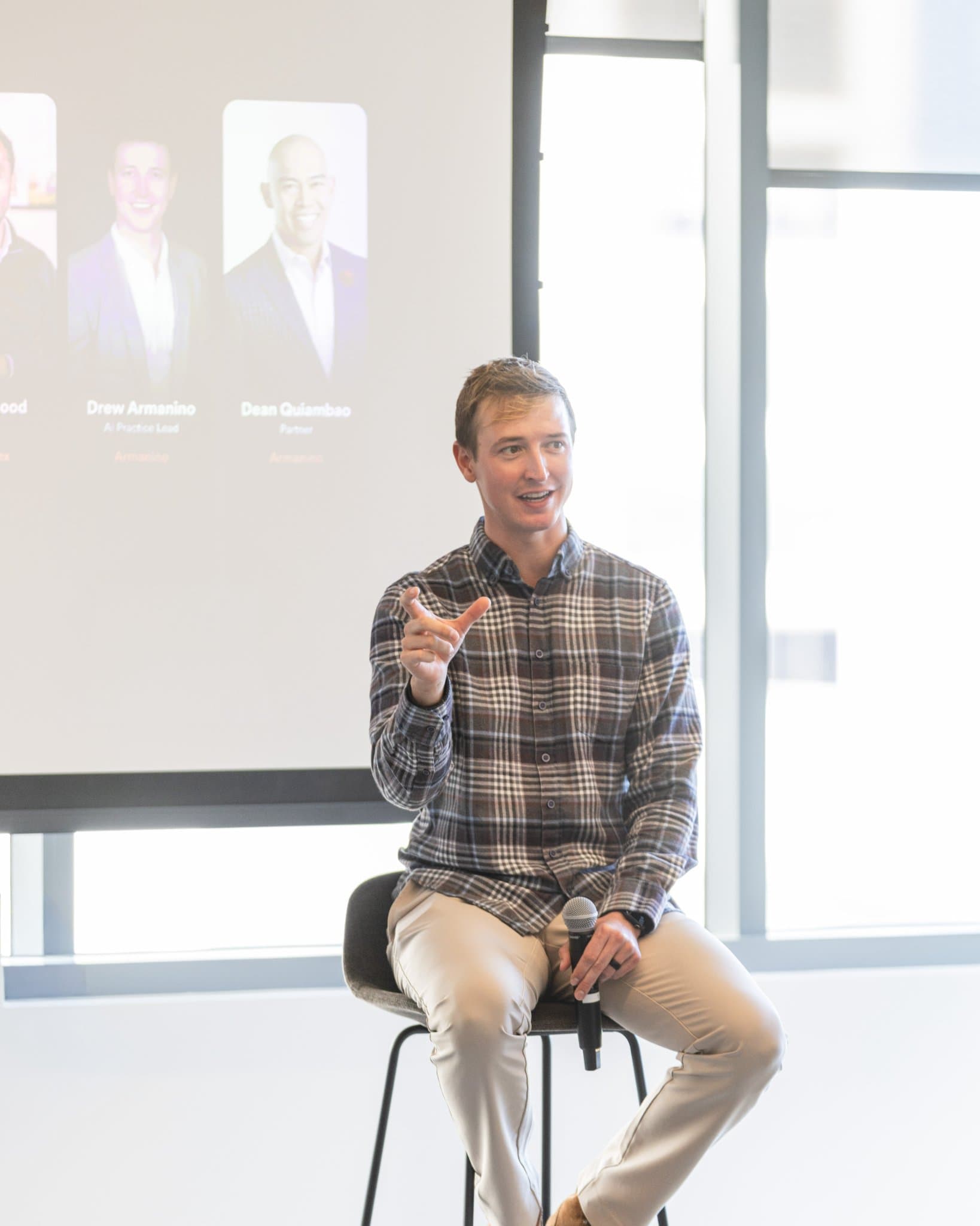 Portrait of Drew Armanino, AI Practice Lead at Armanino, smiling on stage at Airwallex's Beyond the Hype: AI and the Future of Finance breakfast fireside chat at the Airwallex San Francisco office by JY Studio