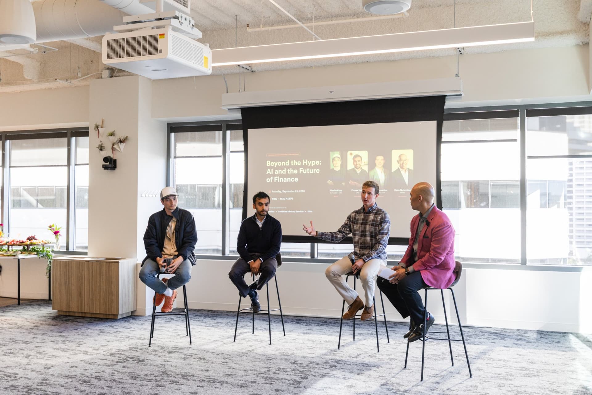 Wide view of the panel and audience in the sunlit event space at Airwallex's Beyond the Hype: AI and the Future of Finance breakfast fireside chat at the Airwallex San Francisco office by JY Studio