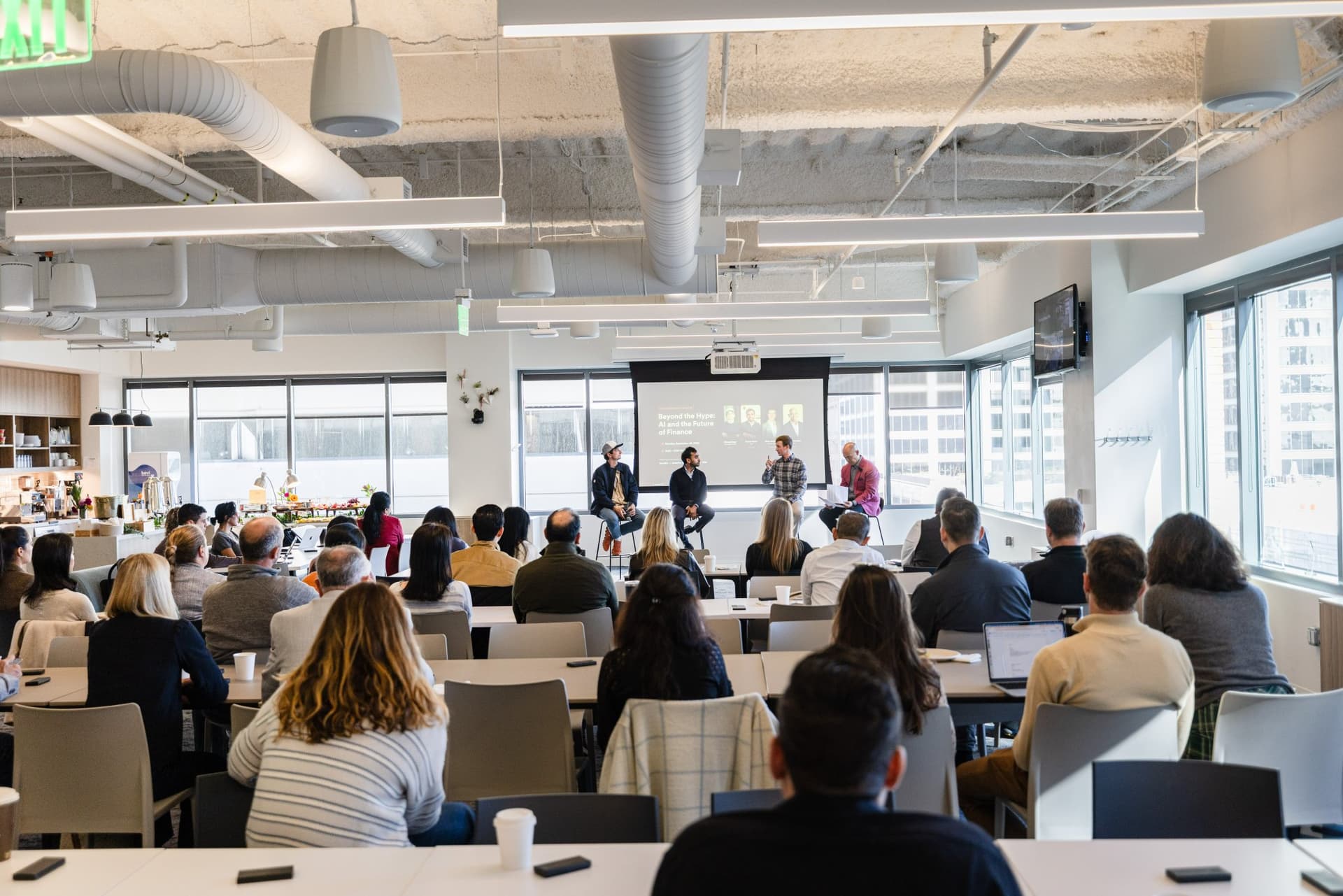 Audience watching the panel from the back of the room at Airwallex's Beyond the Hype: AI and the Future of Finance breakfast fireside chat at the Airwallex San Francisco office by JY Studio