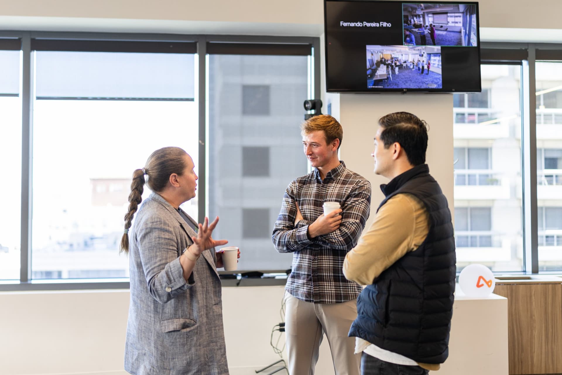 Drew Armanino in conversation with two guests at Airwallex's Beyond the Hype: AI and the Future of Finance breakfast fireside chat at the Airwallex San Francisco office by JY Studio