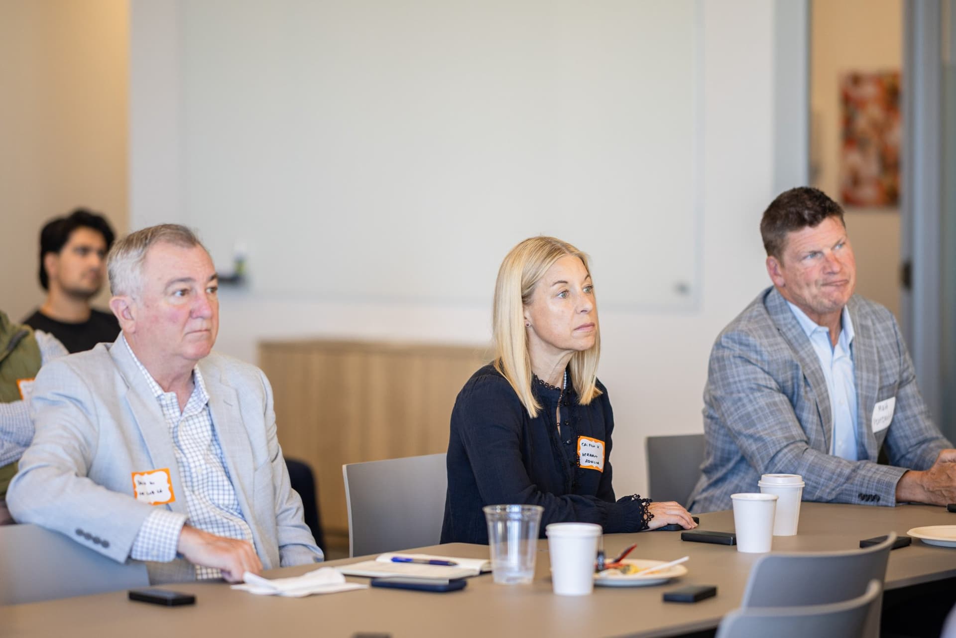 Finance executives listening intently during the fireside chat at Airwallex's Beyond the Hype: AI and the Future of Finance breakfast fireside chat at the Airwallex San Francisco office by JY Studio