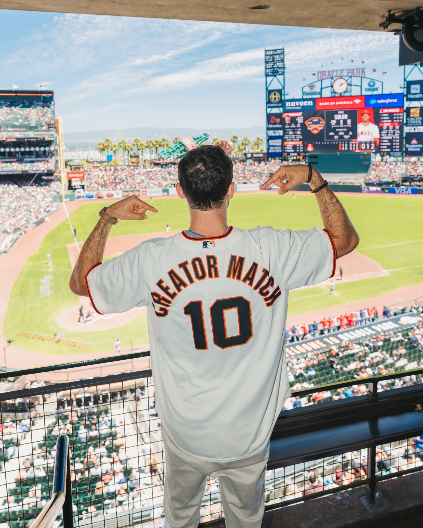 Guests toasting during the Airwallex suite celebration at Oracle Park in San Francisco by JY Studio