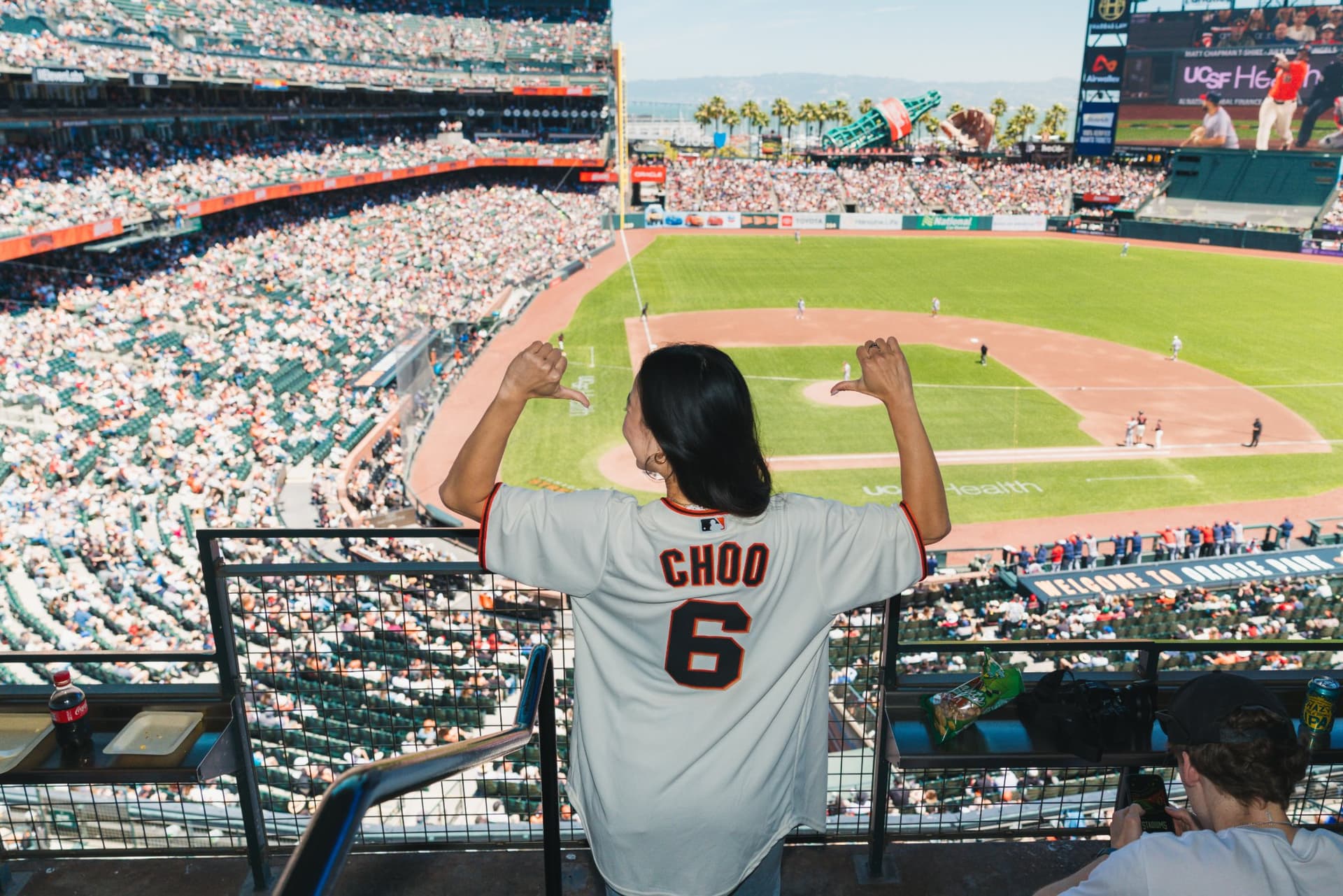 Founders and creators networking inside the Airwallex suite at Oracle Park in San Francisco by JY Studio