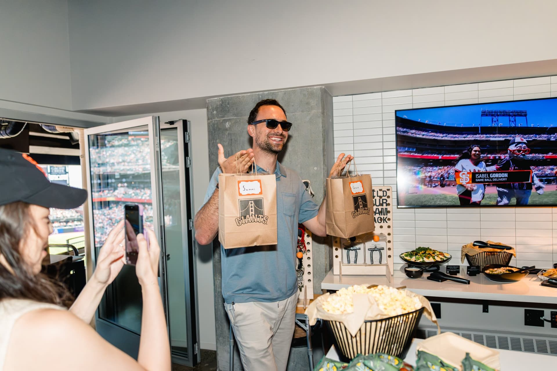 Guests toasting during the Airwallex suite celebration at Oracle Park in San Francisco by JY Studio