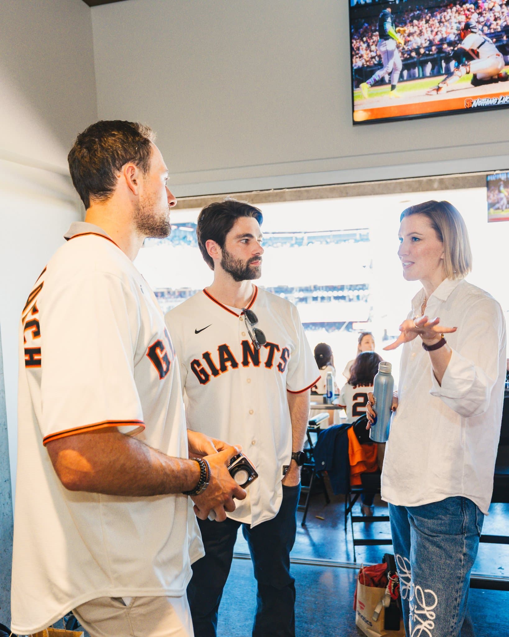 Airwallex team members hosting guests at the SF Giants suite event in San Francisco by JY Studio