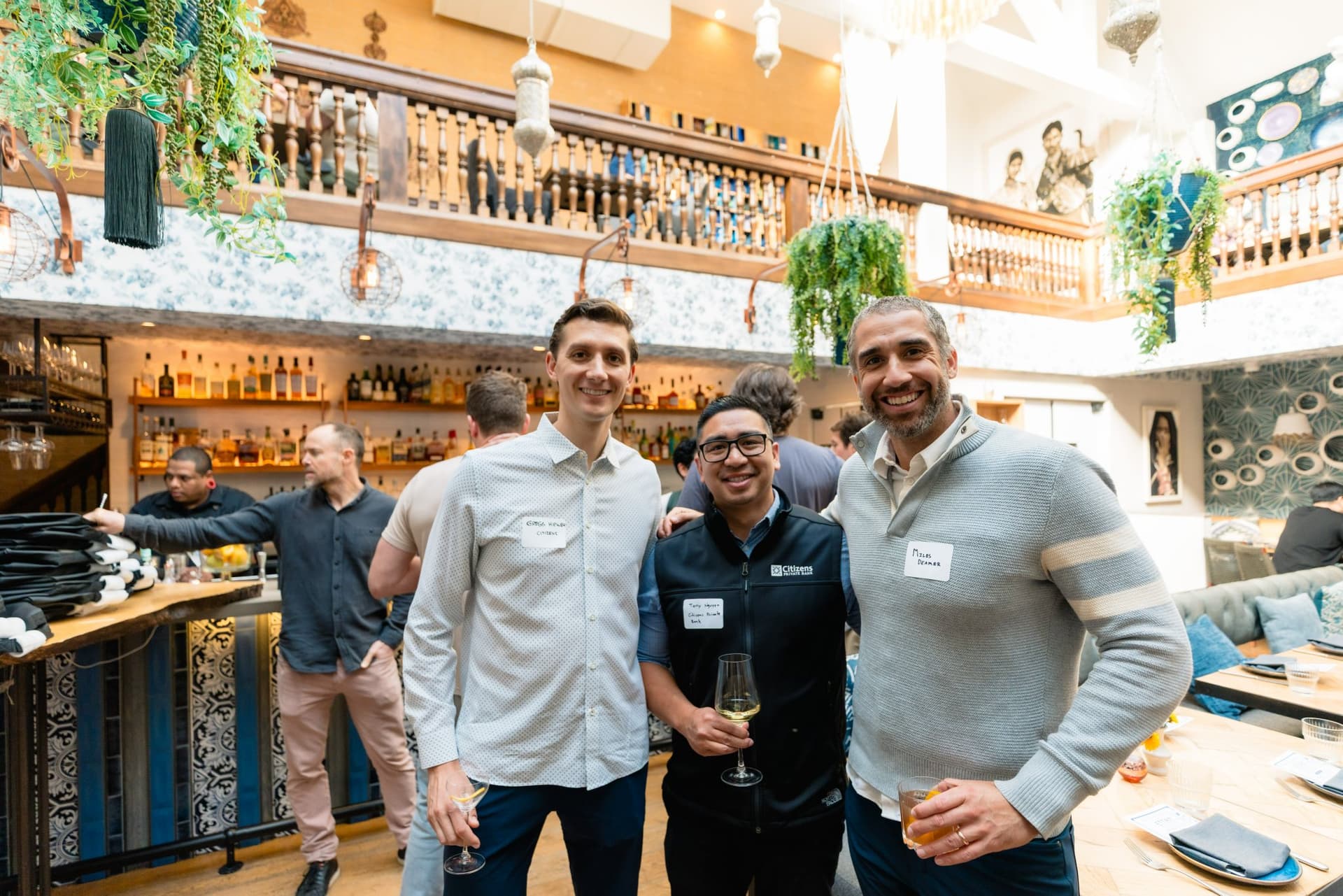 Guests discussing AI projects at the Apollo AI Accelerator reception in Los Altos by JY Studio