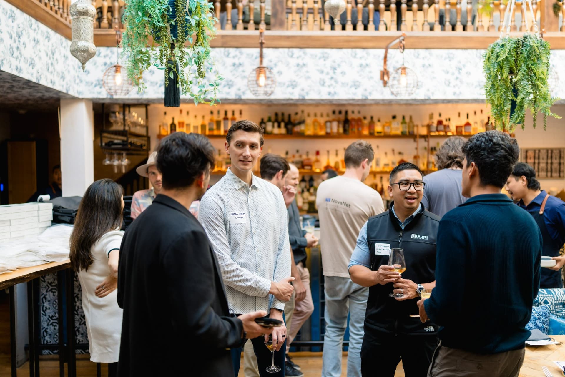 Guests and mentors sharing a laugh at the Apollo AI Accelerator networking event in Los Altos, Bay Area by JY Studio