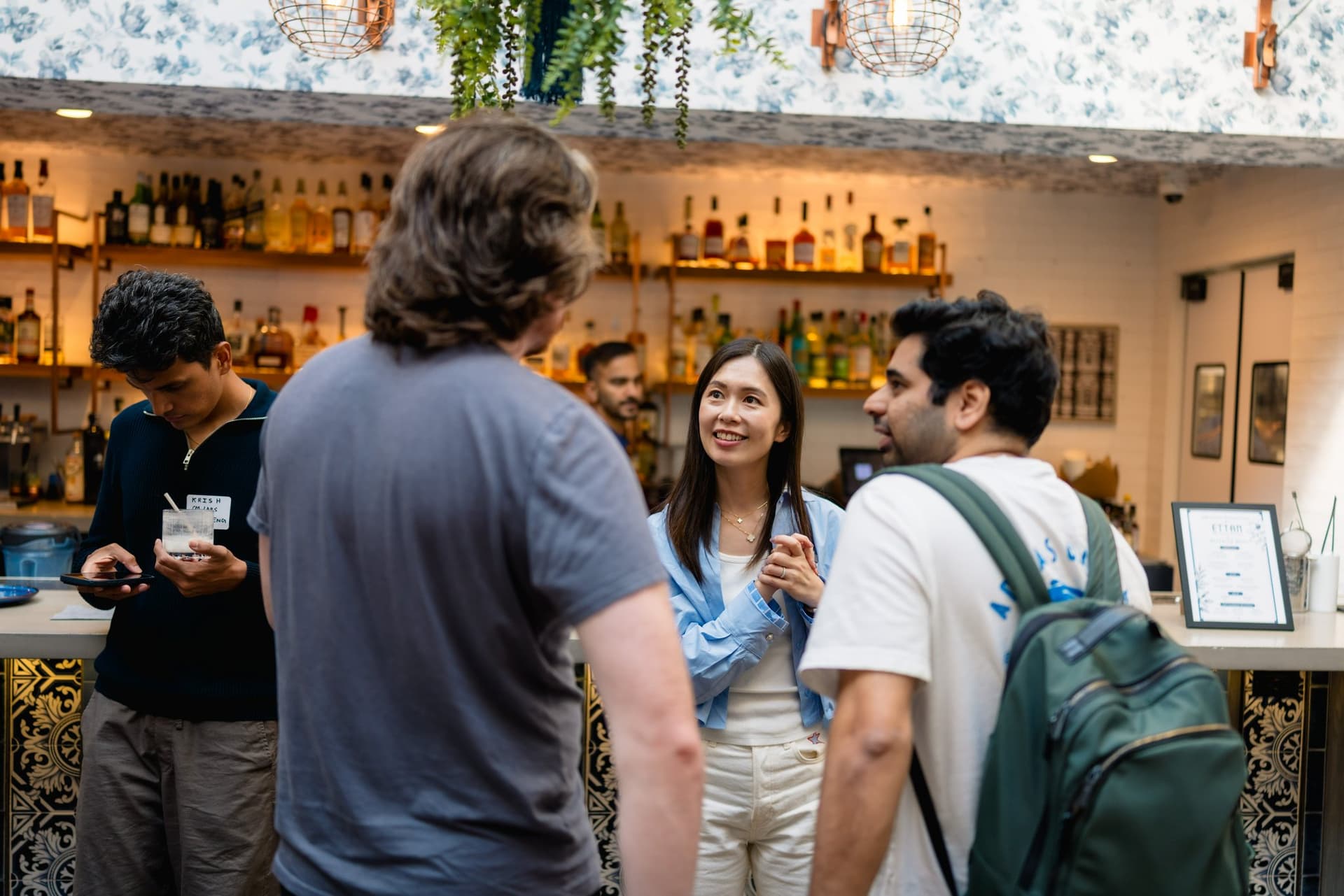 Startup founders toasting drinks at the Apollo AI Accelerator networking event in Los Altos, Bay Area by JY Studio