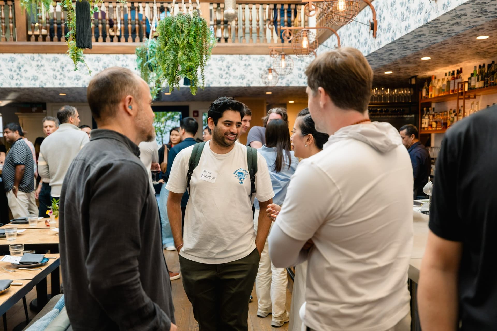 AI founders sharing a laugh at the Apollo AI Accelerator reception in Los Altos, Bay Area by JY Studio