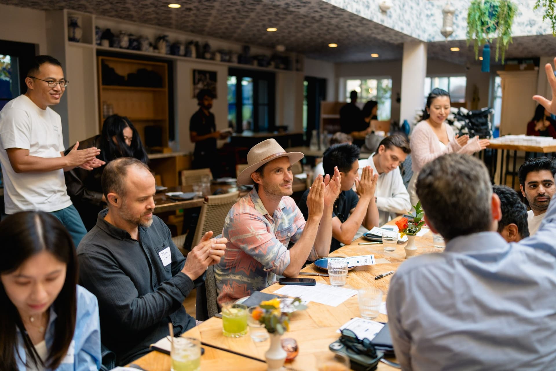Founders and builders toasting drinks at the Apollo AI Accelerator reception in Los Altos, Bay Area by JY Studio