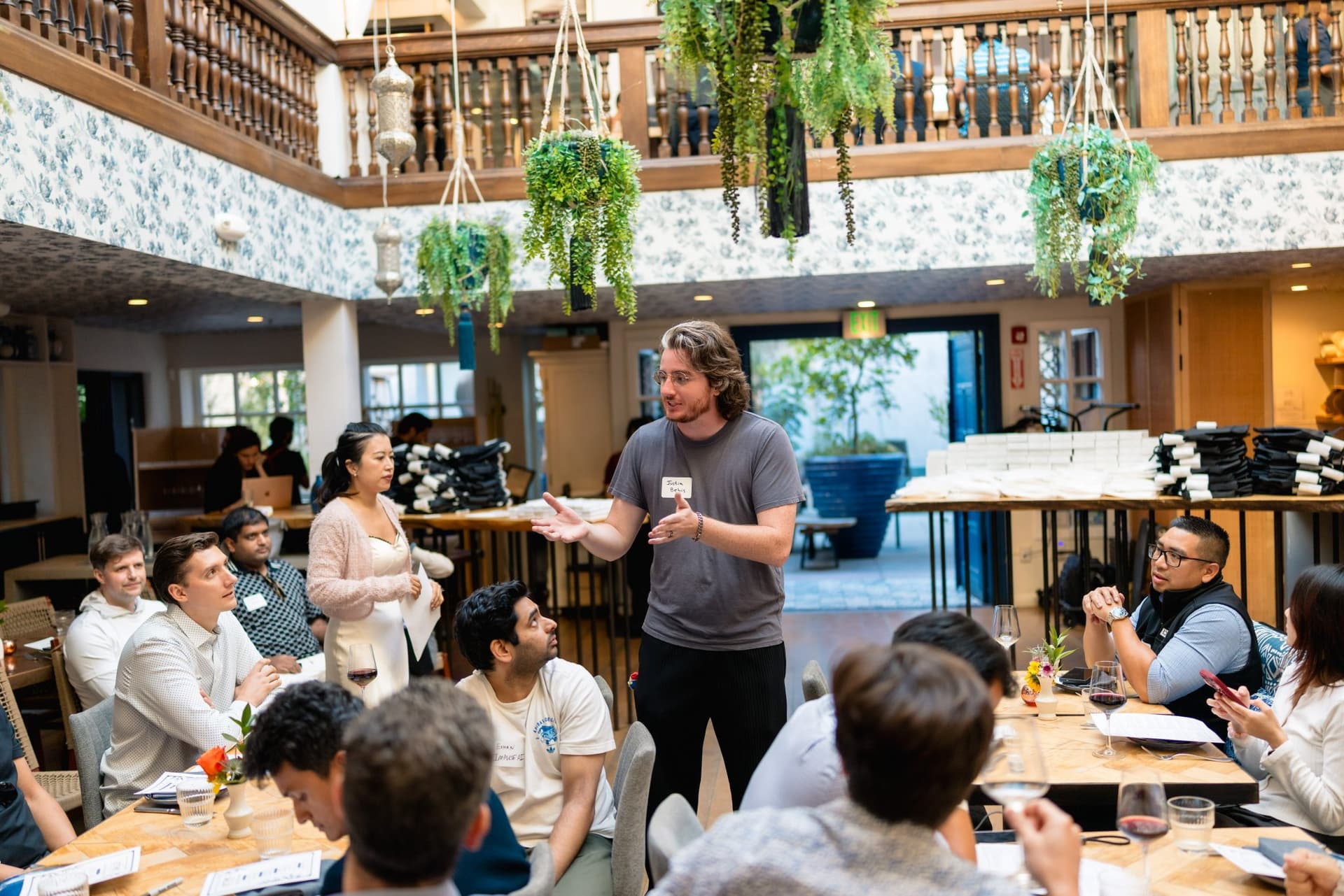 Startup founders mingling during the Apollo AI Accelerator reception in Los Altos by JY Studio