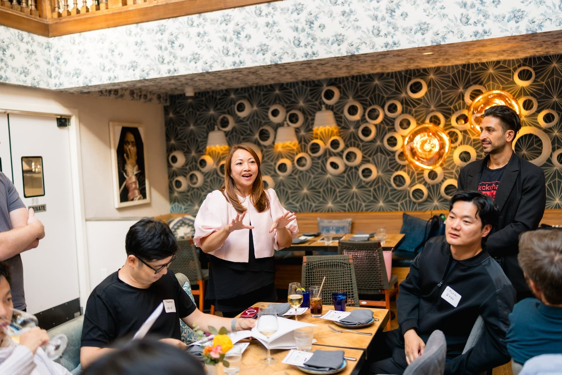 Guests sharing a laugh at the Apollo AI Accelerator networking event in Los Altos by JY Studio