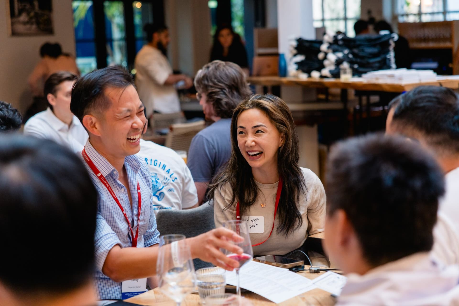 Guests sharing a laugh at Apollo, the AI Accelerator powered by 0G and Stanford Builders, in Los Altos, Silicon Valley by JY Studio
