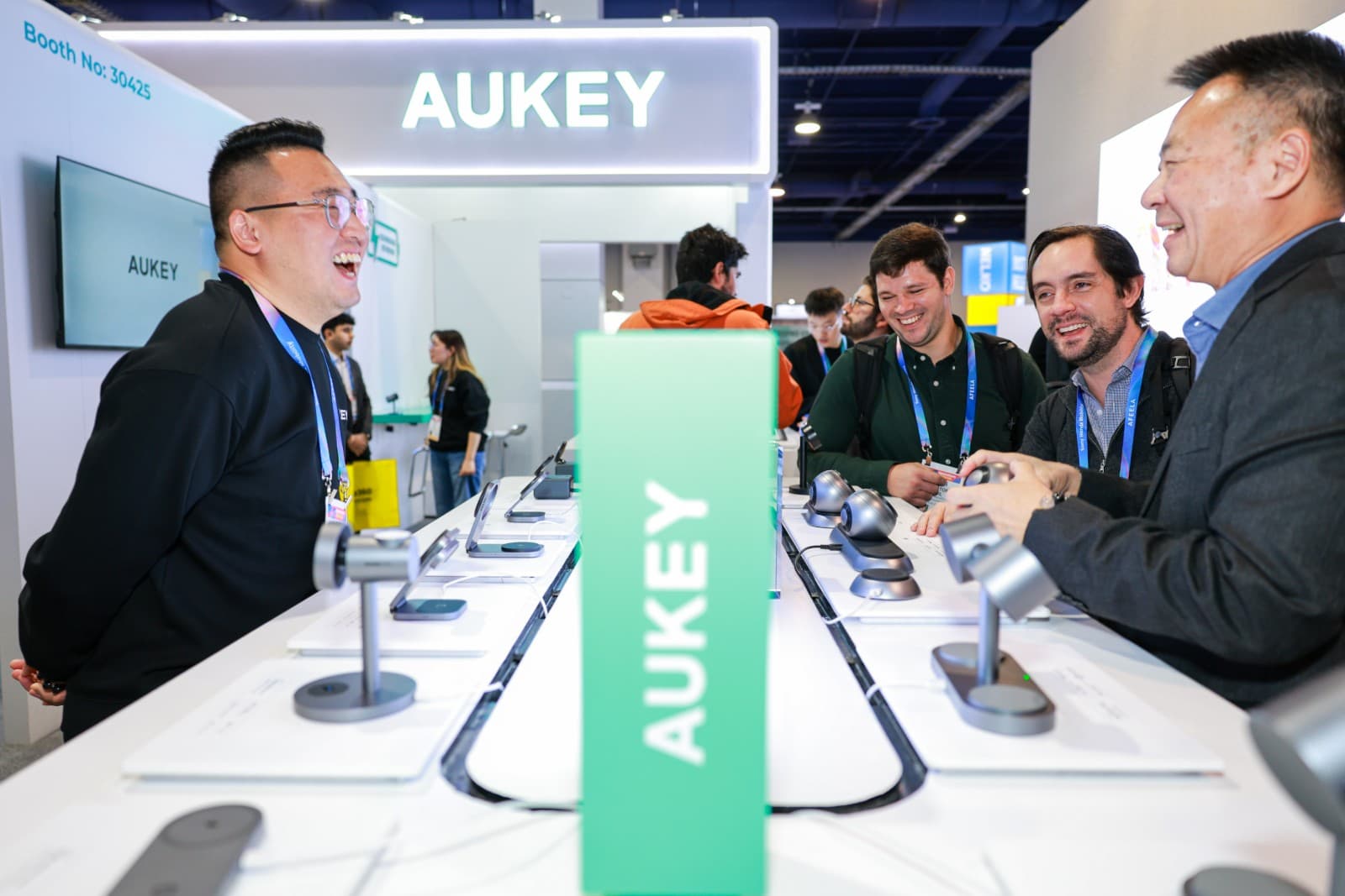 Professional trade show photography capturing AUKEY team and products at CES 2026 in Las Vegas by JY Studio