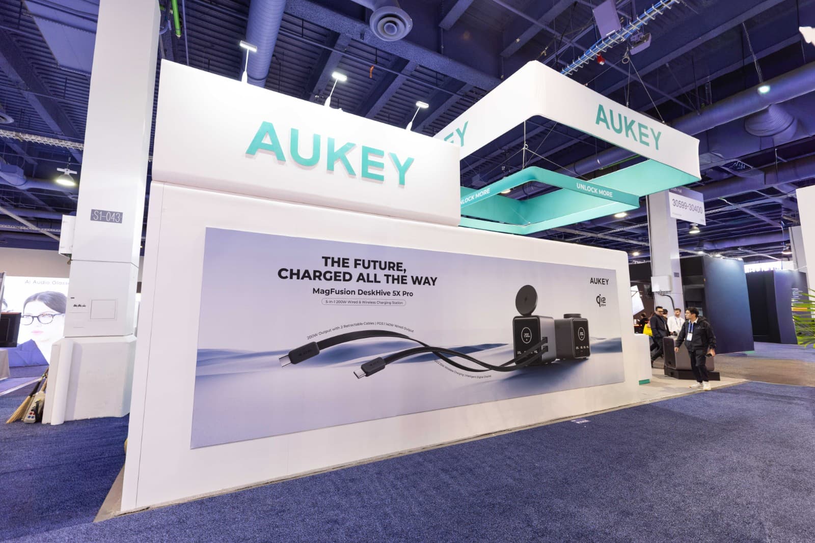 Visitors exploring AUKEY booth at CES 2026 trade show in Las Vegas by JY Studio