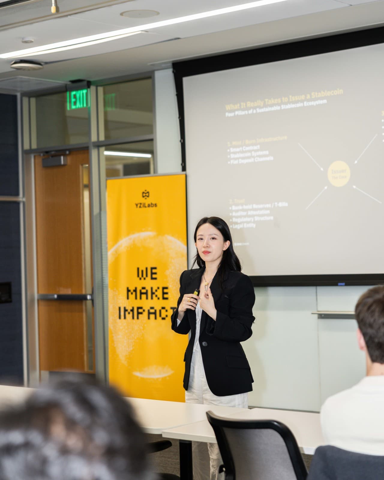 Keynote speaker presenting on crypto and blockchain innovation at BNB Chain event at Stanford University by JY Studio