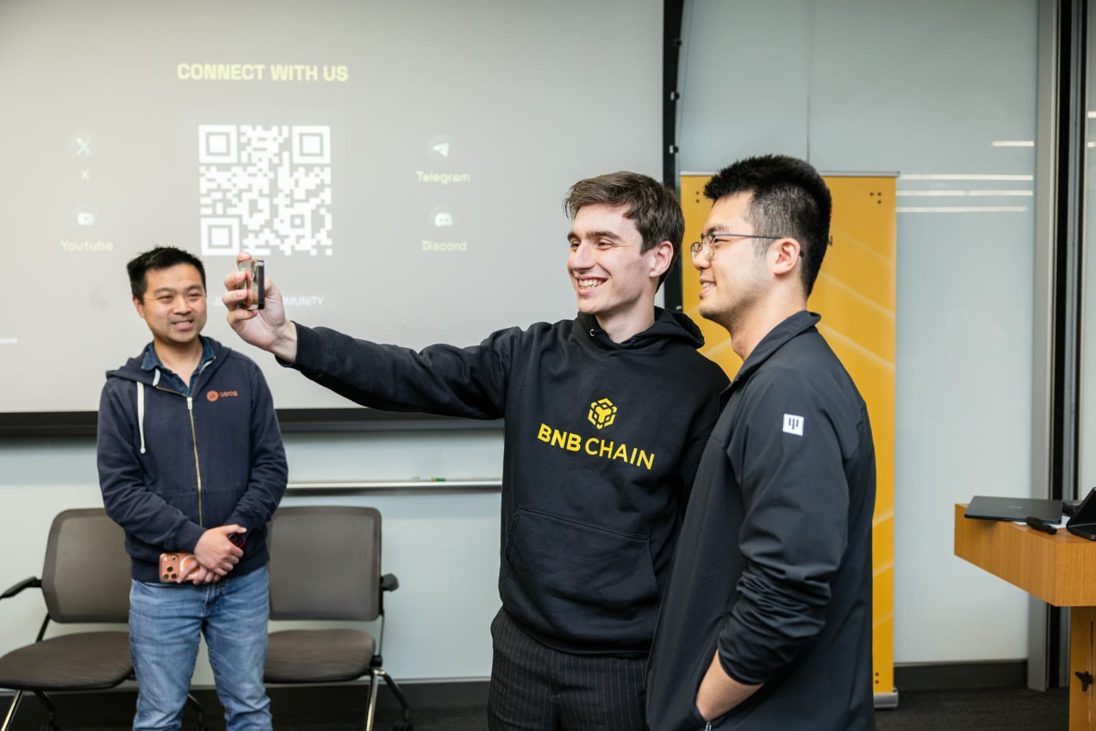 Audience members asking questions during BNB Chain blockchain presentation at UC Berkeley by JY Studio