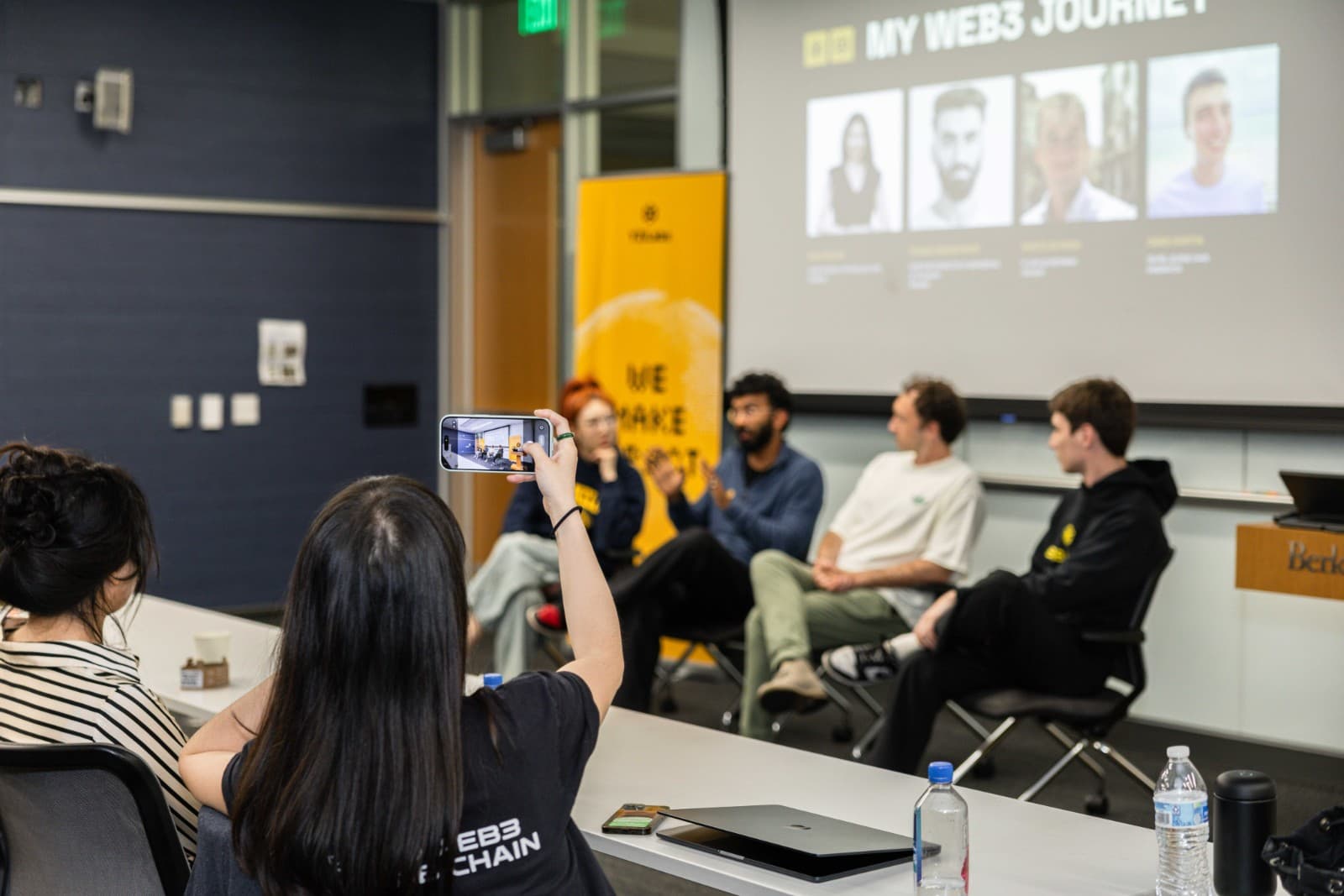 Candid networking moment between crypto and blockchain enthusiasts at BNB Chain Berkeley event by JY Studio