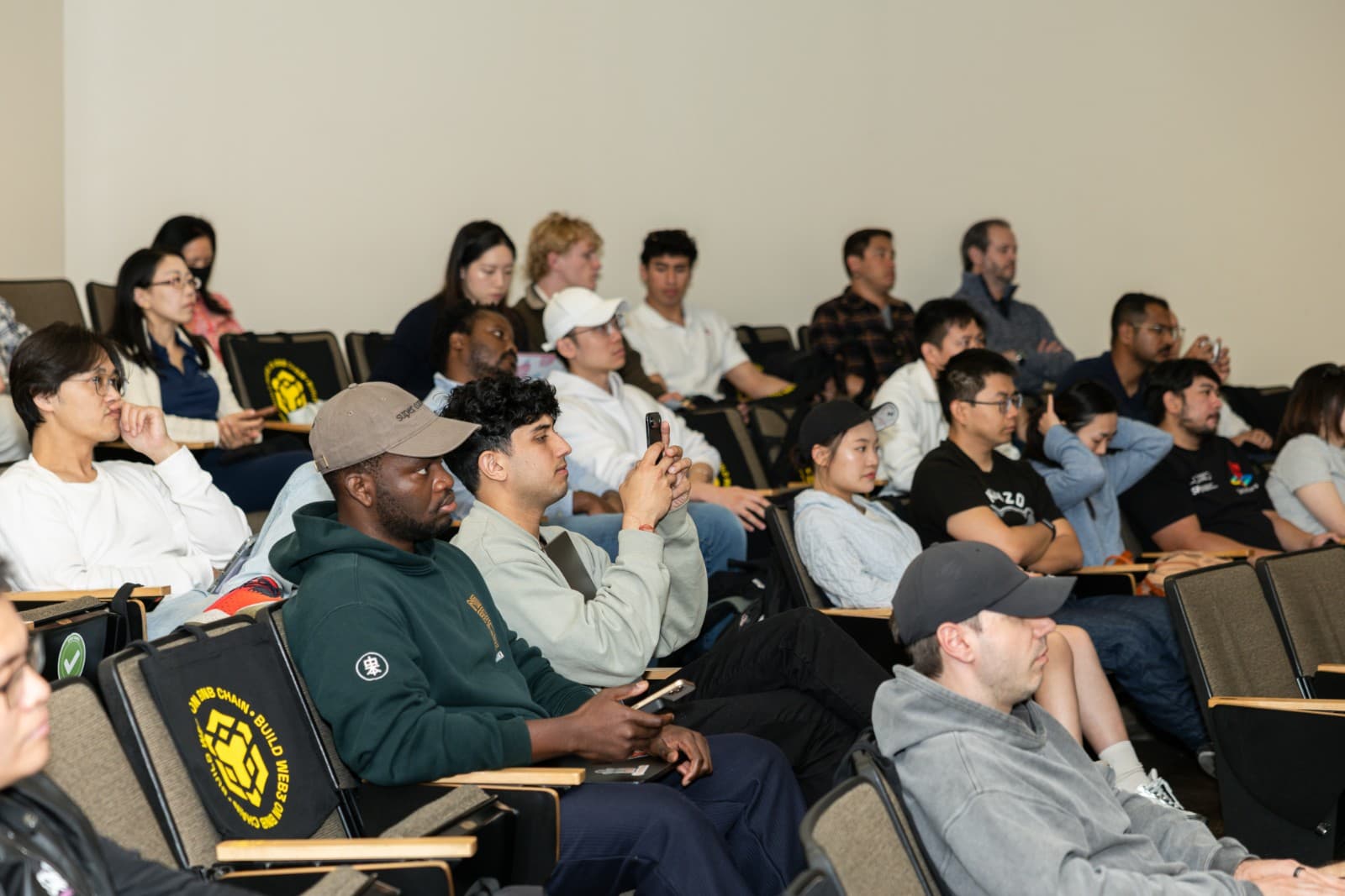 Stanford students attending BNB Chain Web3 presentation in lecture hall by JY Studio