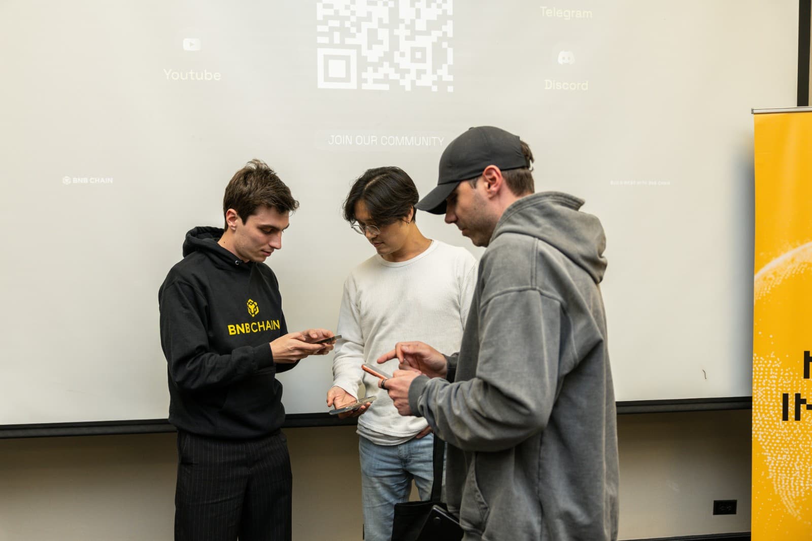 Audience reaction during blockchain demo at BNB Chain Stanford University event by JY Studio