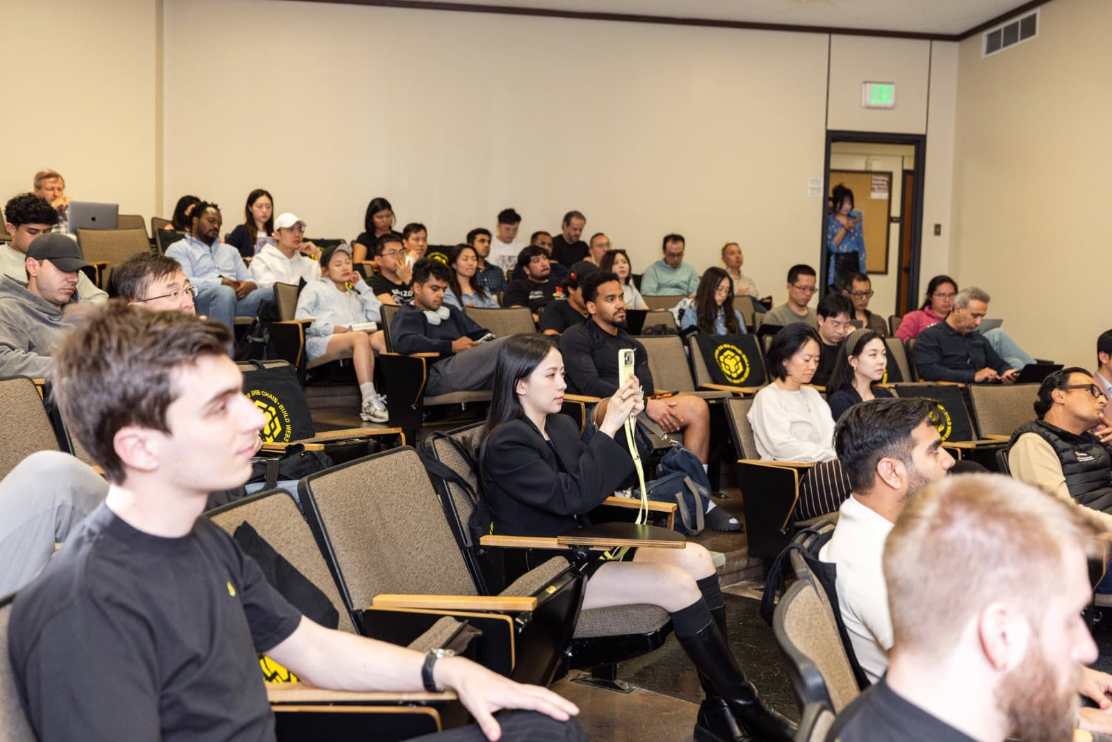 Binance BNB Chain swag distribution and booth interaction at Stanford University event by JY Studio