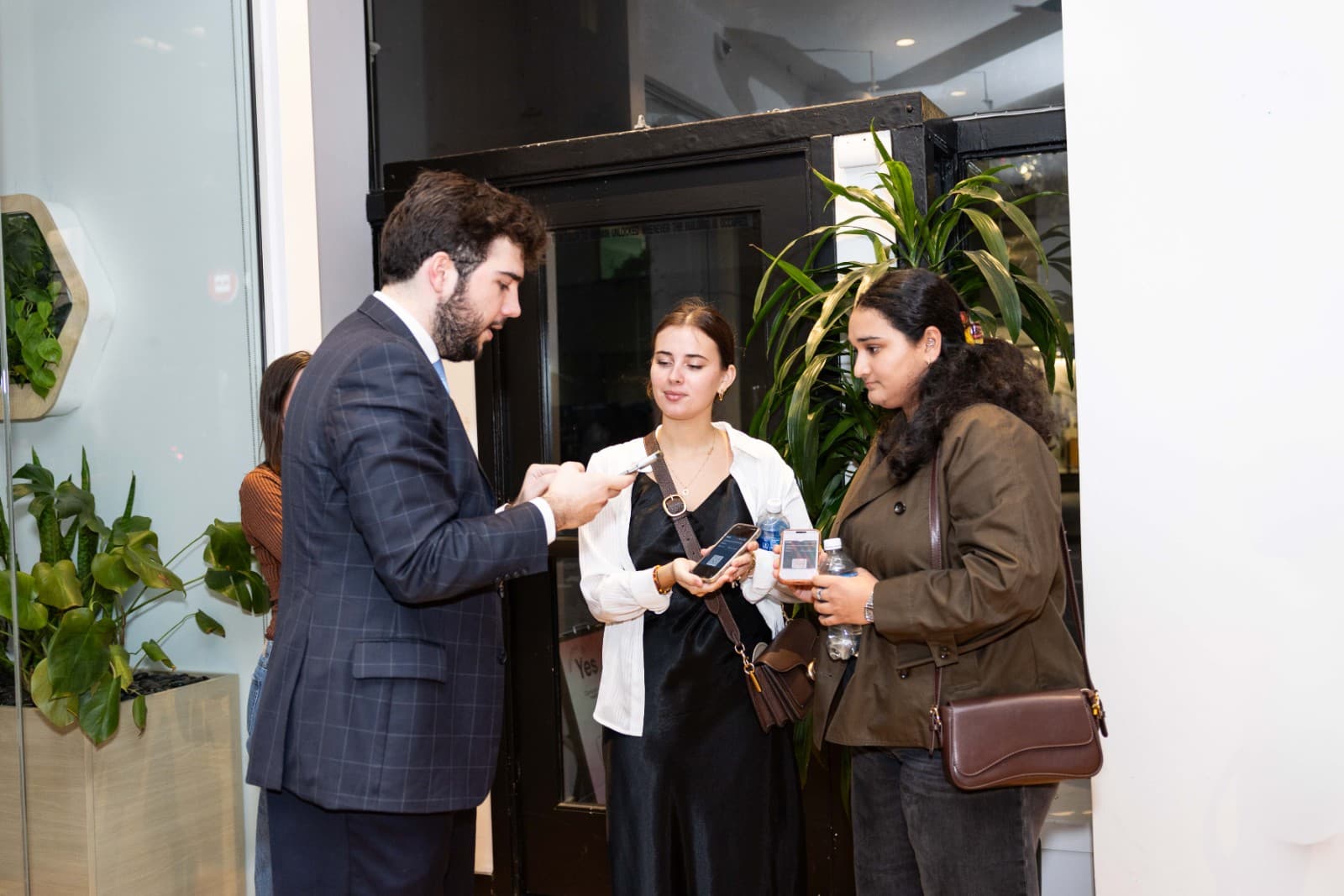Guest speakers addressing attendees at CAN Networking Event at Yes SF in San Francisco by JY Studio