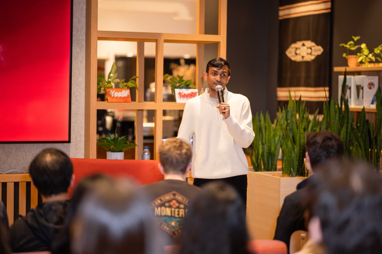 Smiling guests enjoying the CAN Networking Event at Yes SF venue in San Francisco by JY Studio