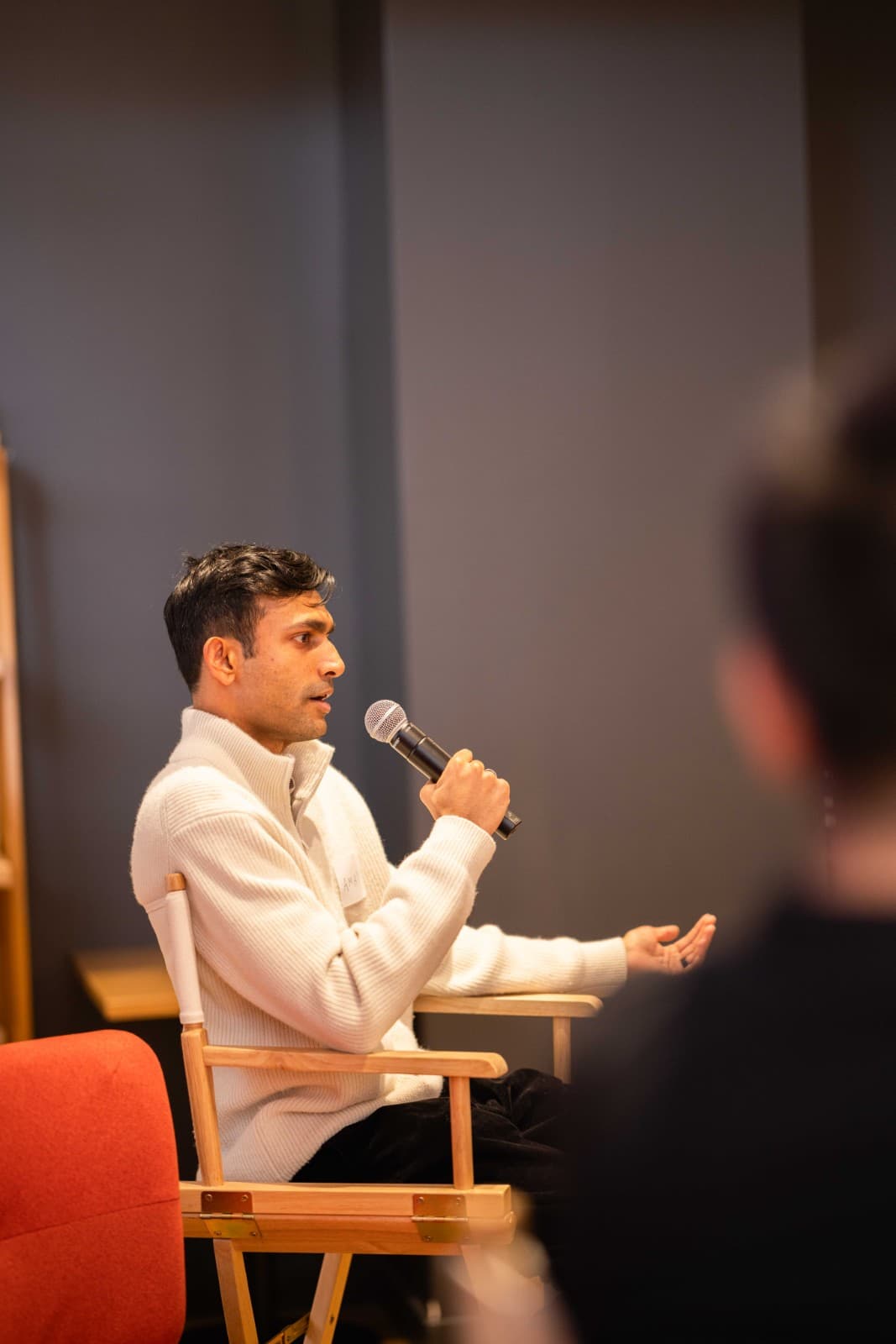 Thoughtful discussion between professionals at Crimson Alumni Network event by JY Studio