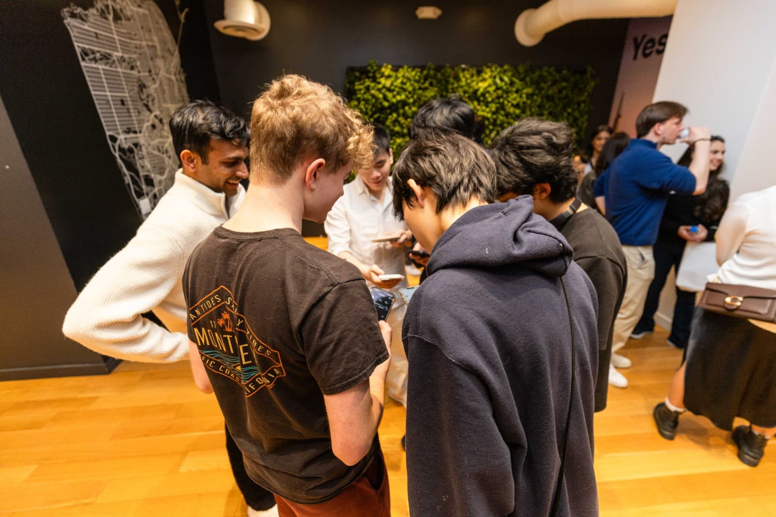 Diverse professionals networking at CAN event at Yes SF in San Francisco Bay Area by JY Studio