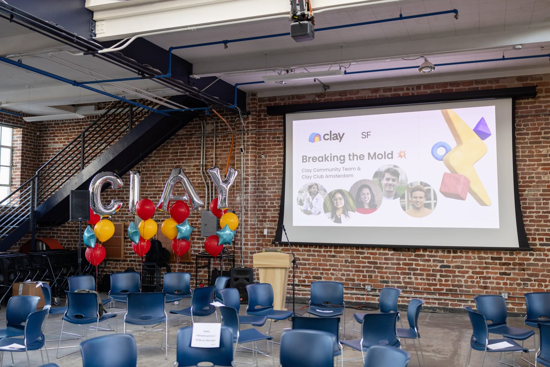 Event space with silver CLAY balloon letters and the Breaking the Mold welcome slide before doors open at Clay's Breaking the Mold community networking event during SF Tech Week 2026 in San Francisco by JY Studio