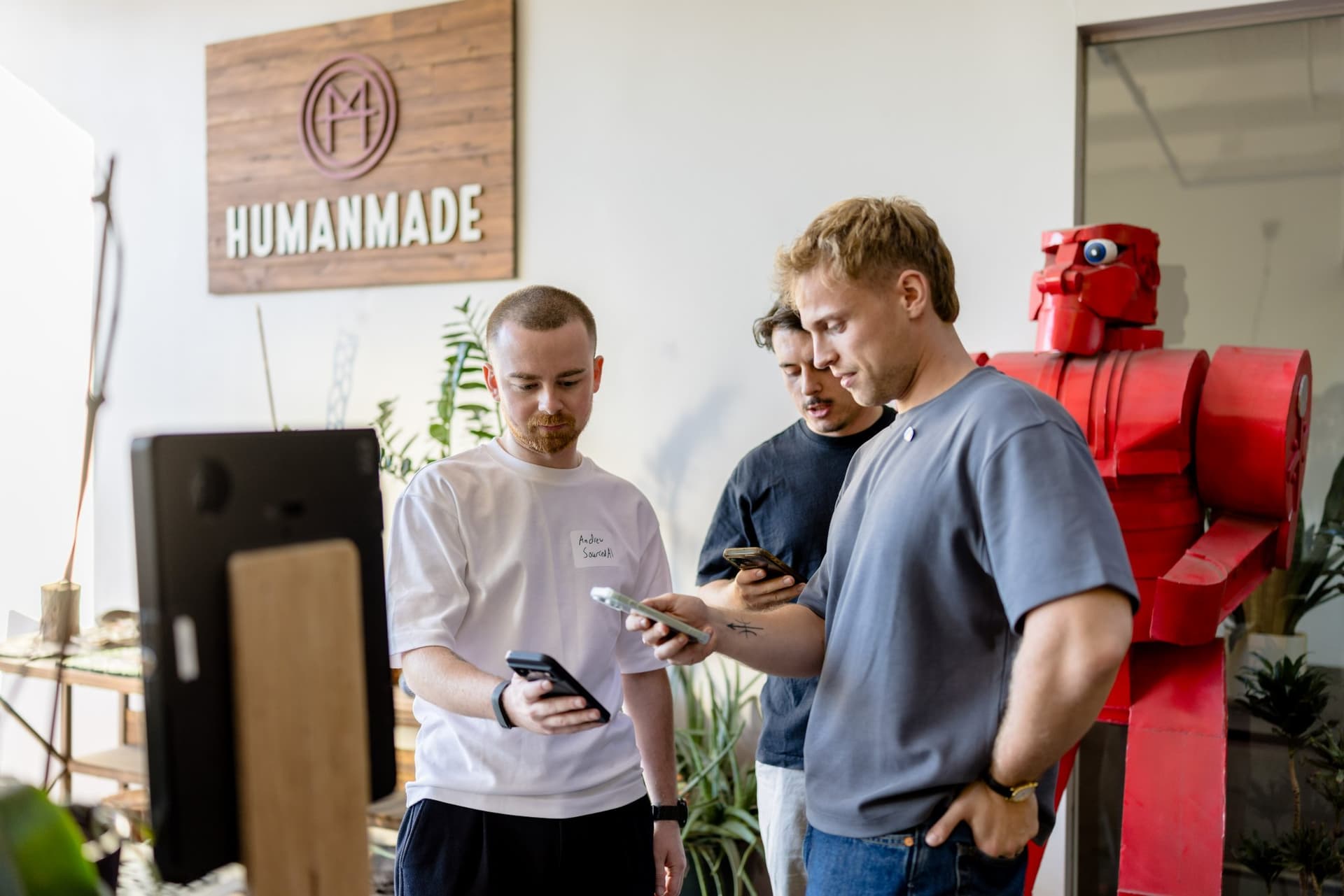 Guests checking in on their phones beside the Humanmade sign at Clay's Breaking the Mold community networking event during SF Tech Week 2026 in San Francisco by JY Studio
