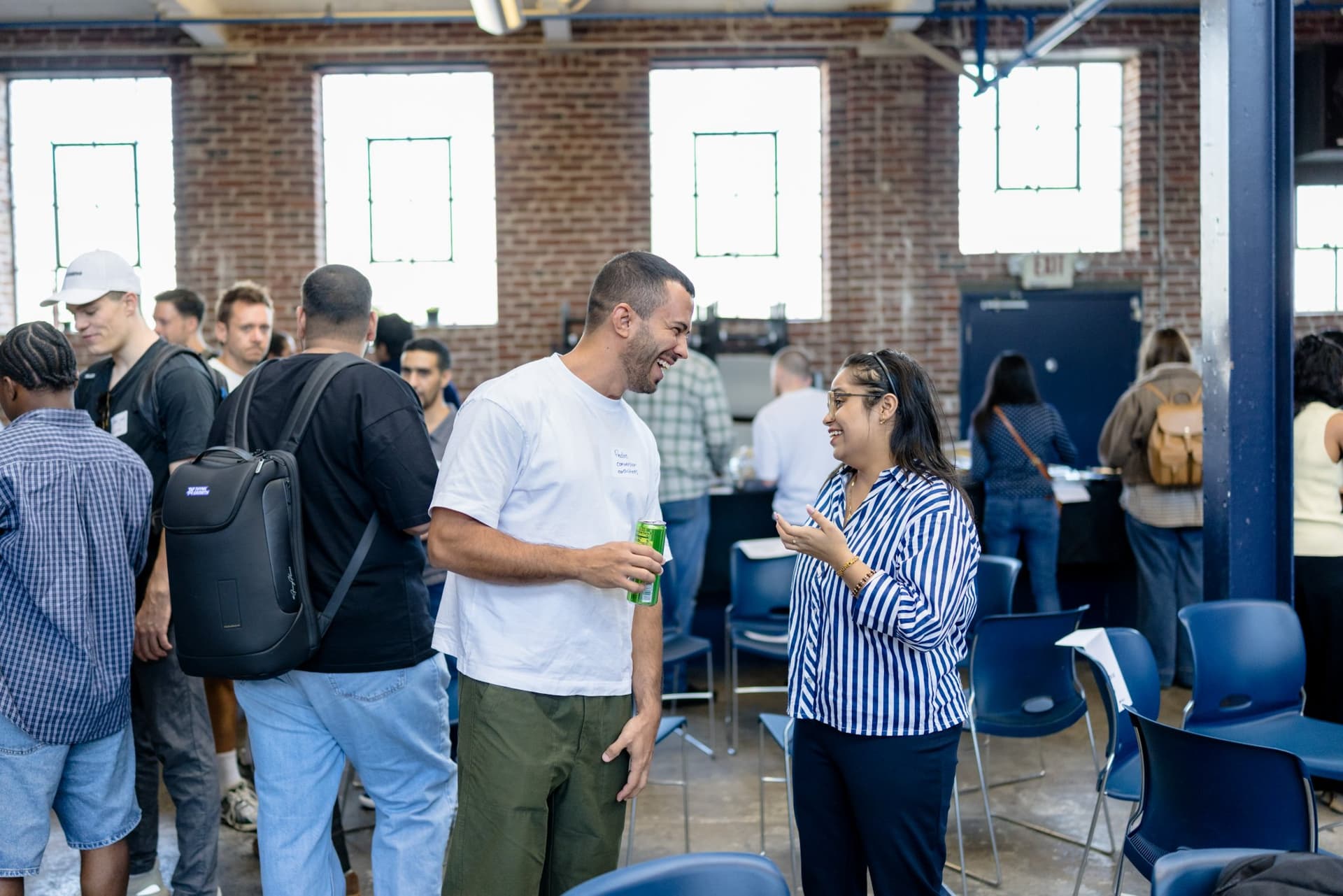 Guests networking in a circle before the program begins at Clay's Breaking the Mold community networking event during SF Tech Week 2026 in San Francisco by JY Studio
