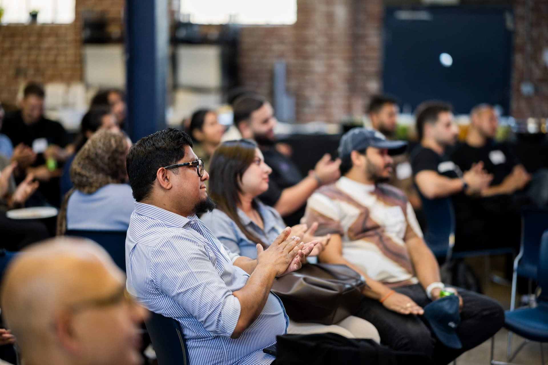 Audience applauding the speakers at Clay's Breaking the Mold community networking event during SF Tech Week 2026 in San Francisco by JY Studio
