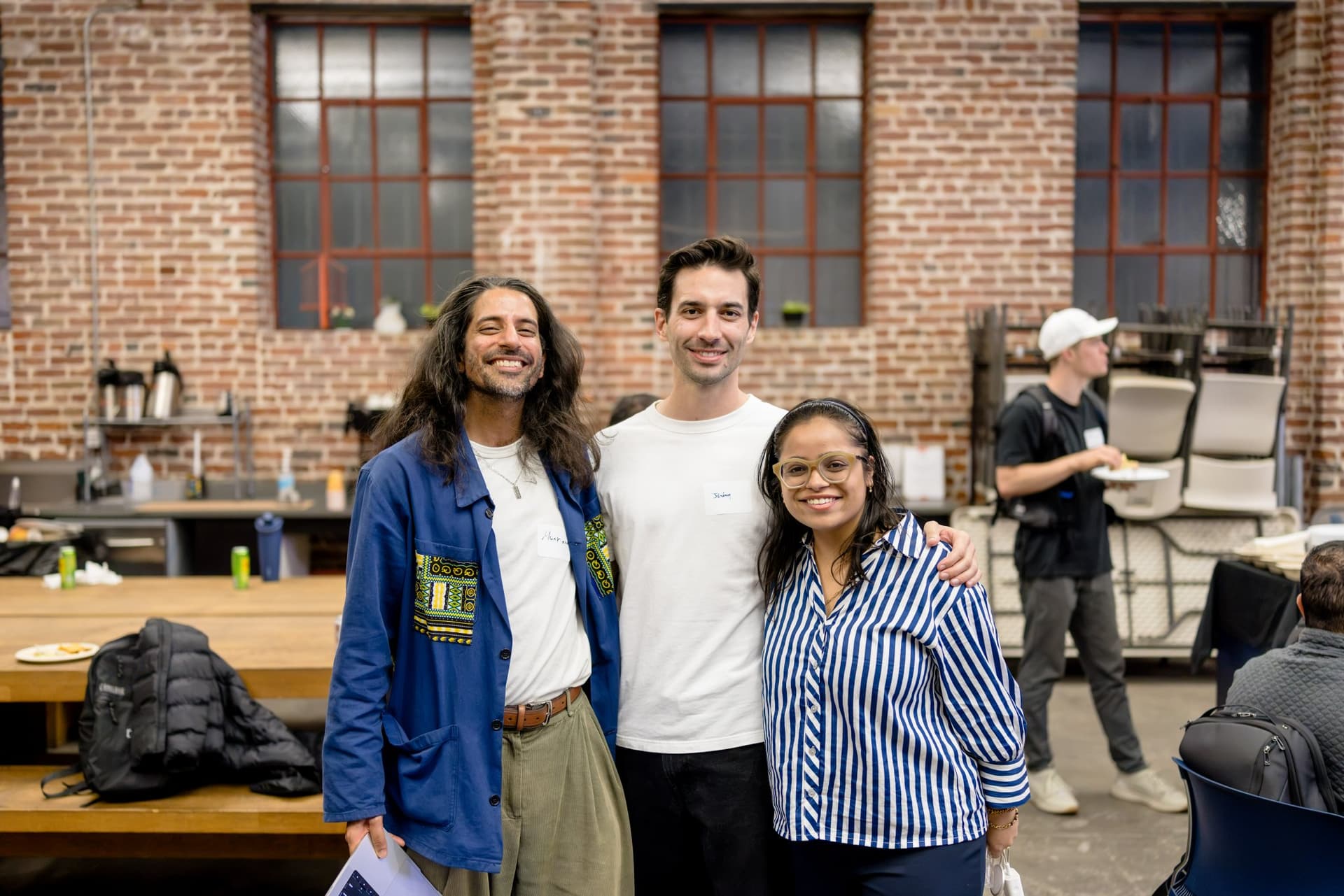 Speaker and hosts posing together after the program at Clay's Breaking the Mold community networking event during SF Tech Week 2026 in San Francisco by JY Studio