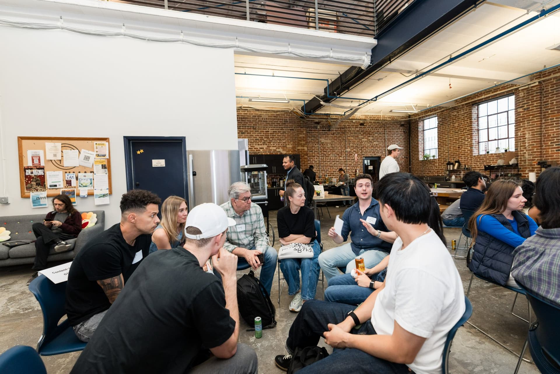 Small-group circle trading tips during the GTM discussion at Clay's Breaking the Mold community networking event during SF Tech Week 2026 in San Francisco by JY Studio