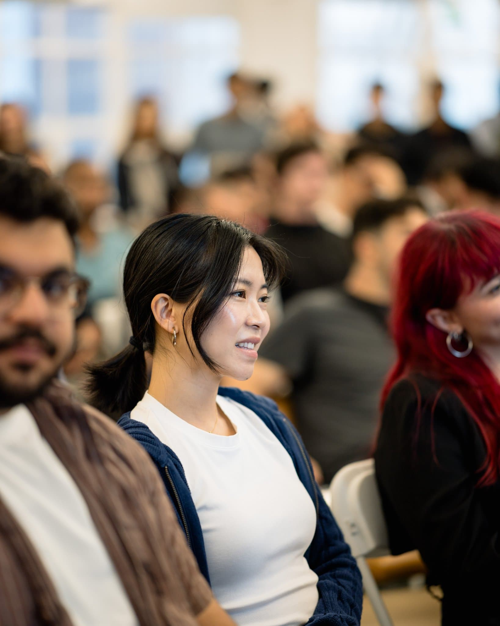 Panelist gesturing while discussing AI-native marketing workflows at the Gumloop event in San Francisco