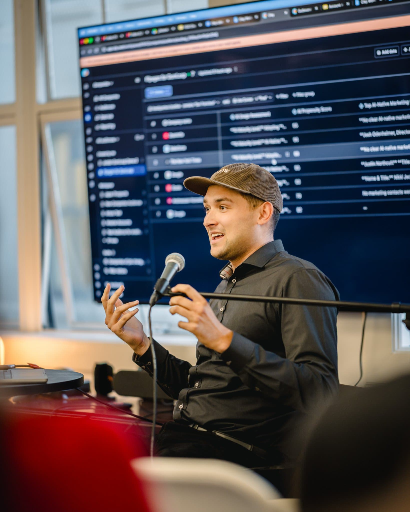 Guest taking notes on a laptop during the Gumloop marketing agents presentation in San Francisco