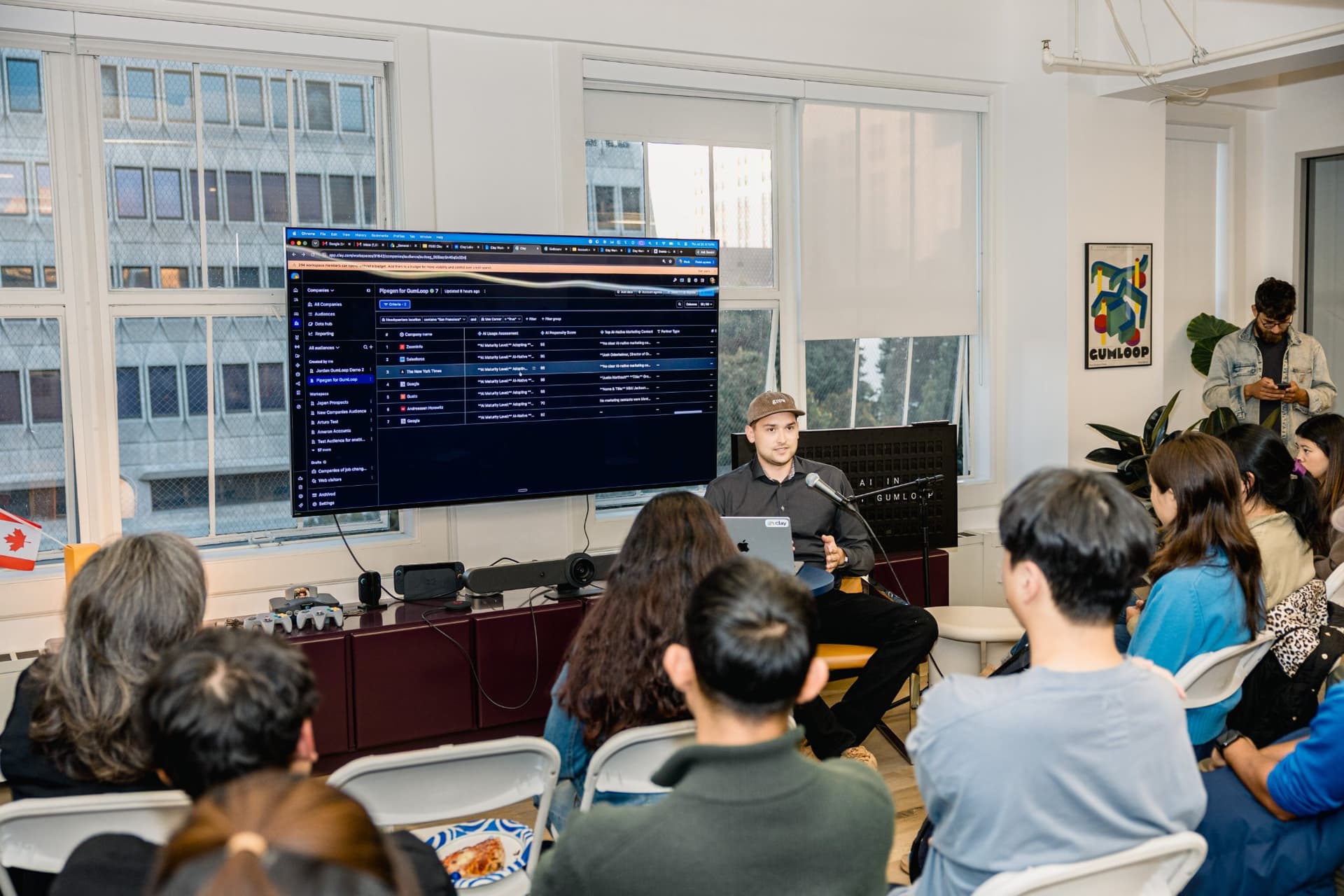 Live product demo of an AI-powered go-to-market data platform on the big screen at Gumloop's San Francisco office