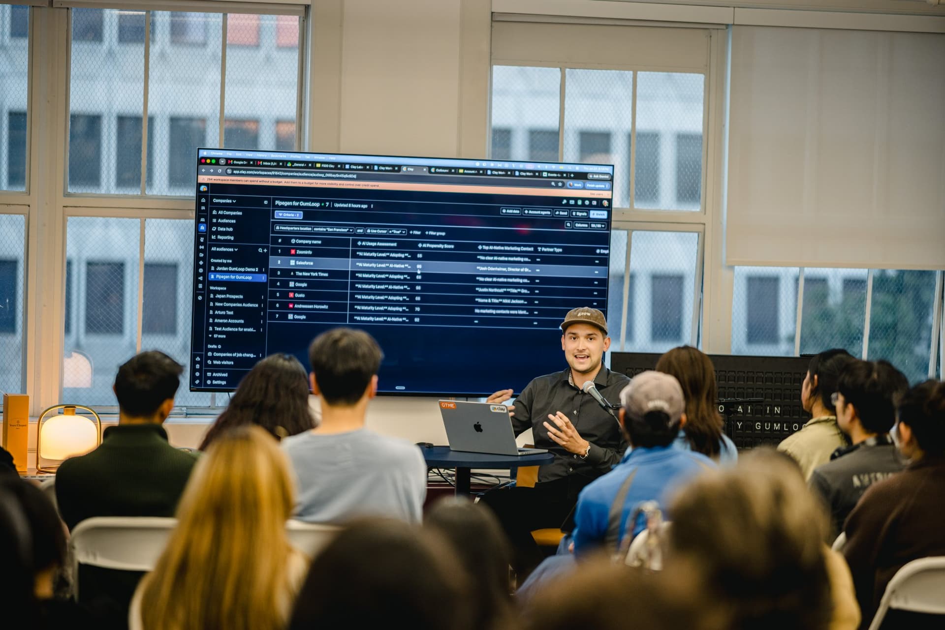 Presenter reviewing account and contact data on screen at the Gumloop AI in Marketing event