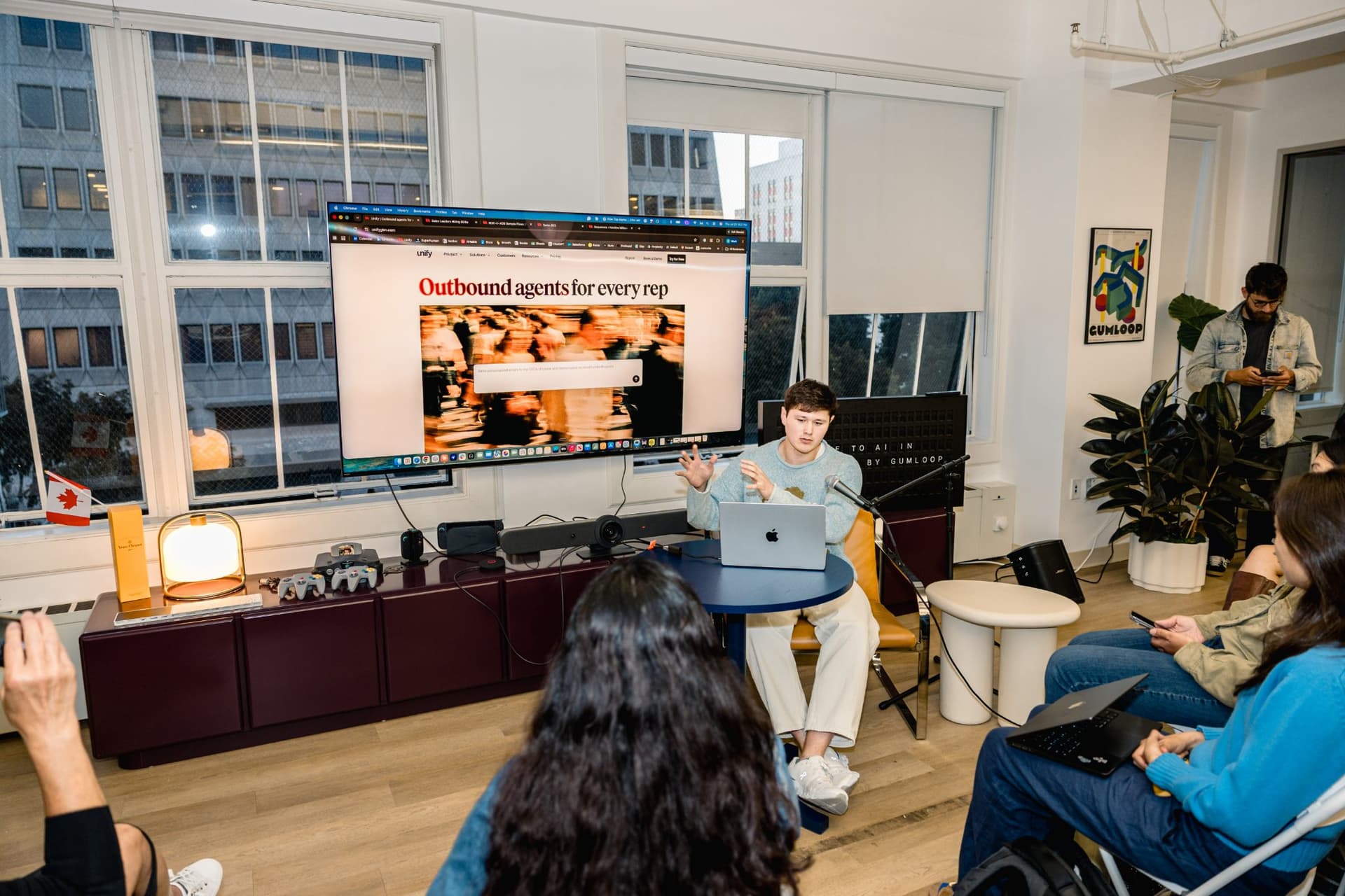 Live demo of an outbound AI sales agent tool projected on screen at Gumloop's San Francisco office