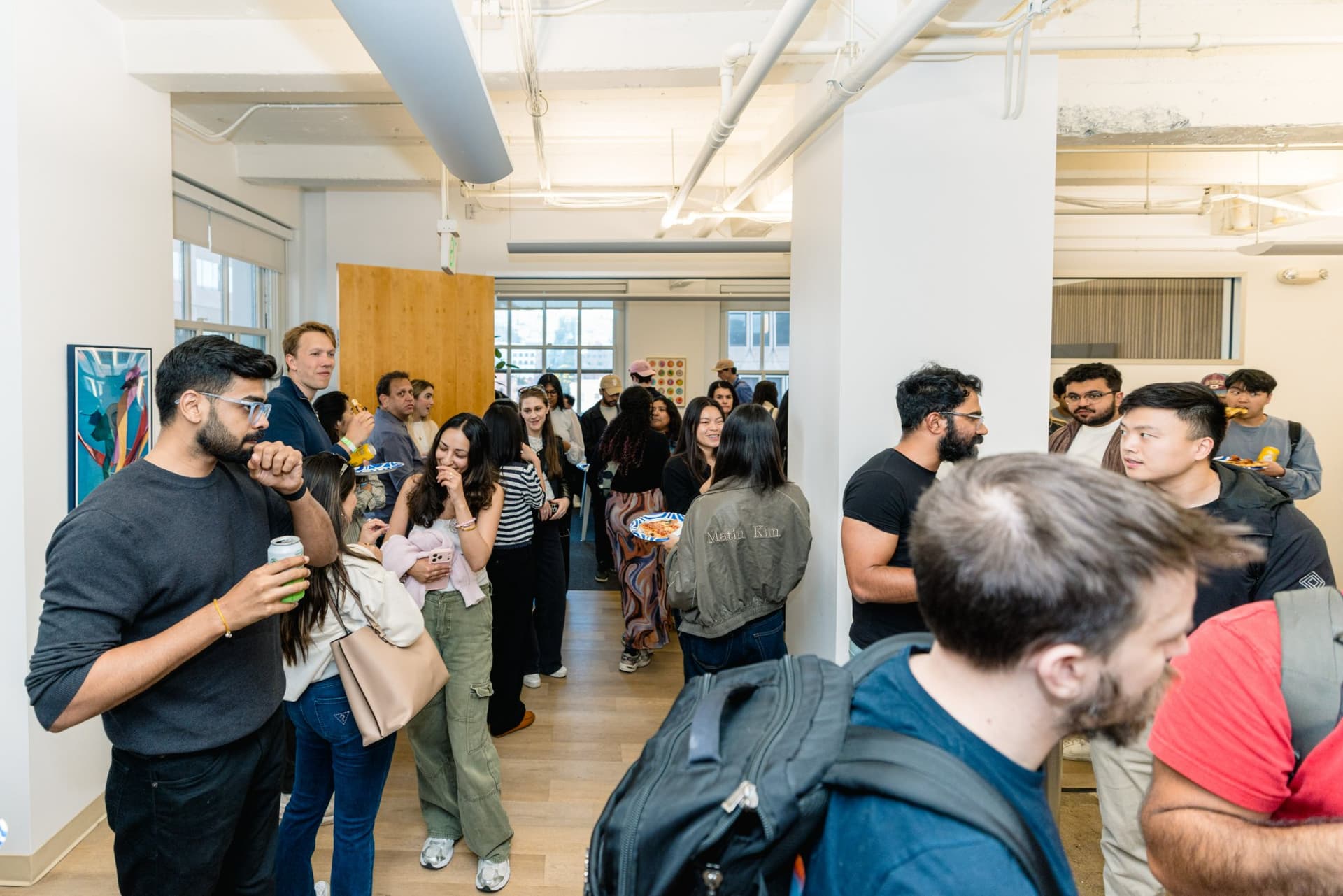 Guests standing at the back of the room during the Gumloop AI in Marketing session in San Francisco