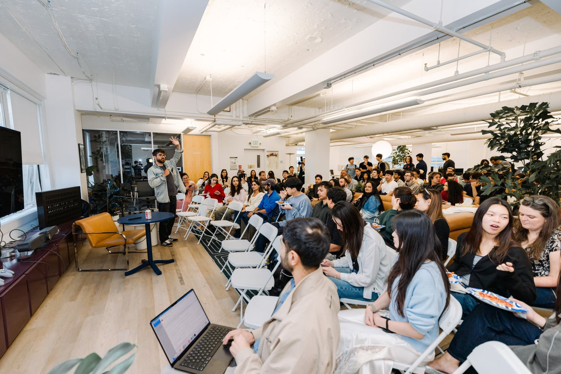 Attendees applauding after a presentation at the Gumloop AI in Marketing event in San Francisco