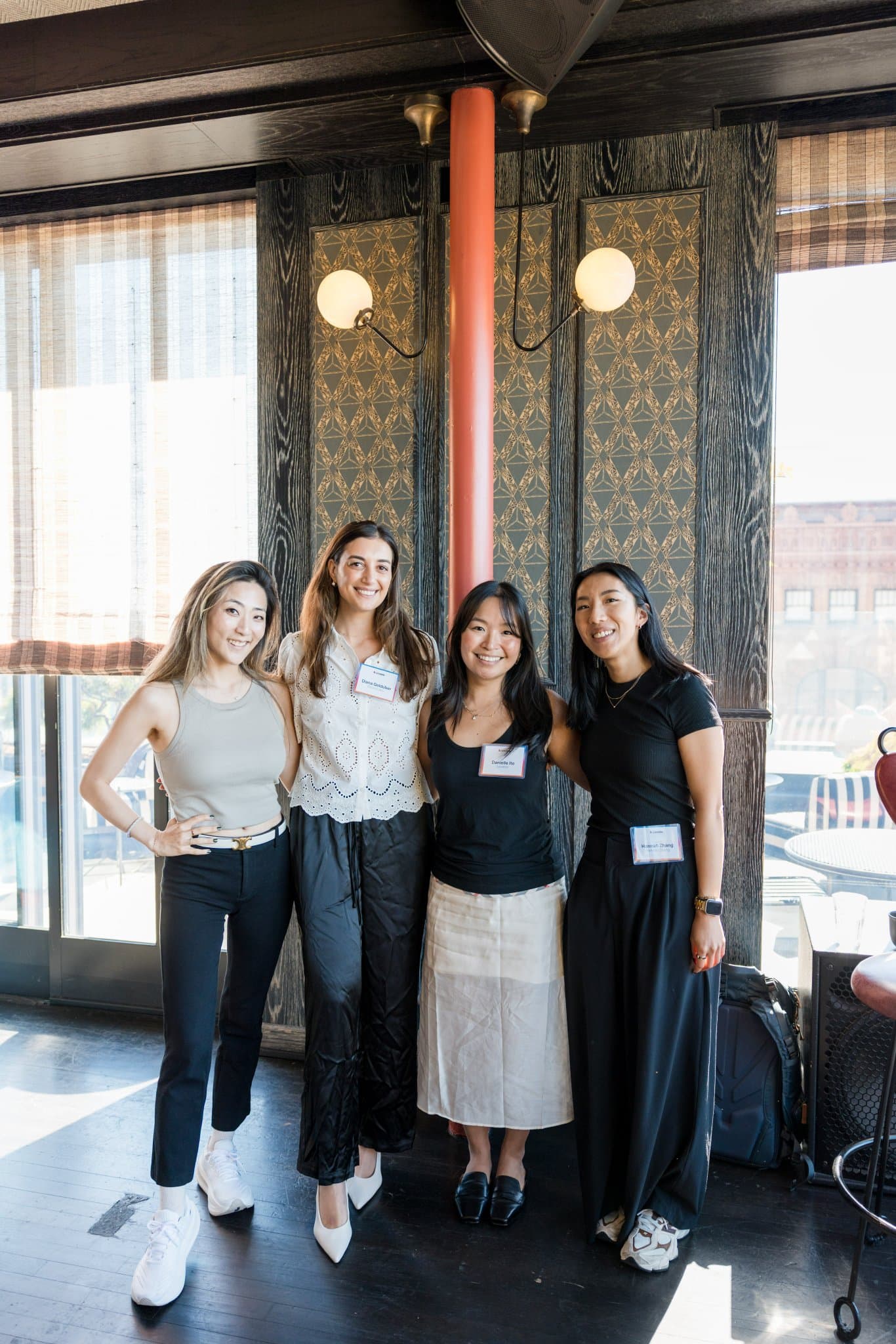 Four women in tech posing together after the brunch at Lovable x Wispr Flow's Built on Her Terms brunch roundtable during SF Tech Week 2026 in San Francisco by JY Studio
