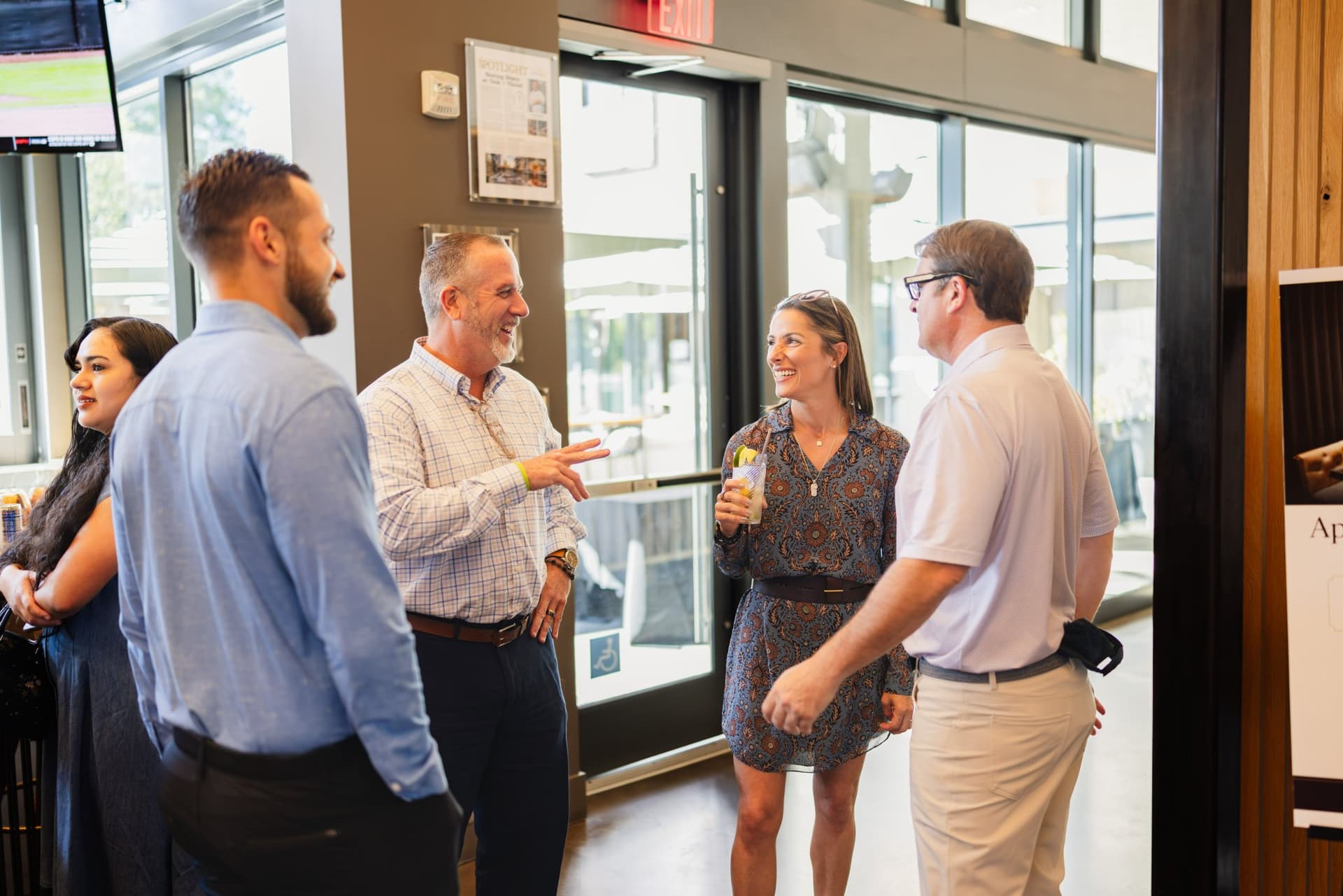 Candid conversation between two guests at the Magnus networking reception in Palo Alto