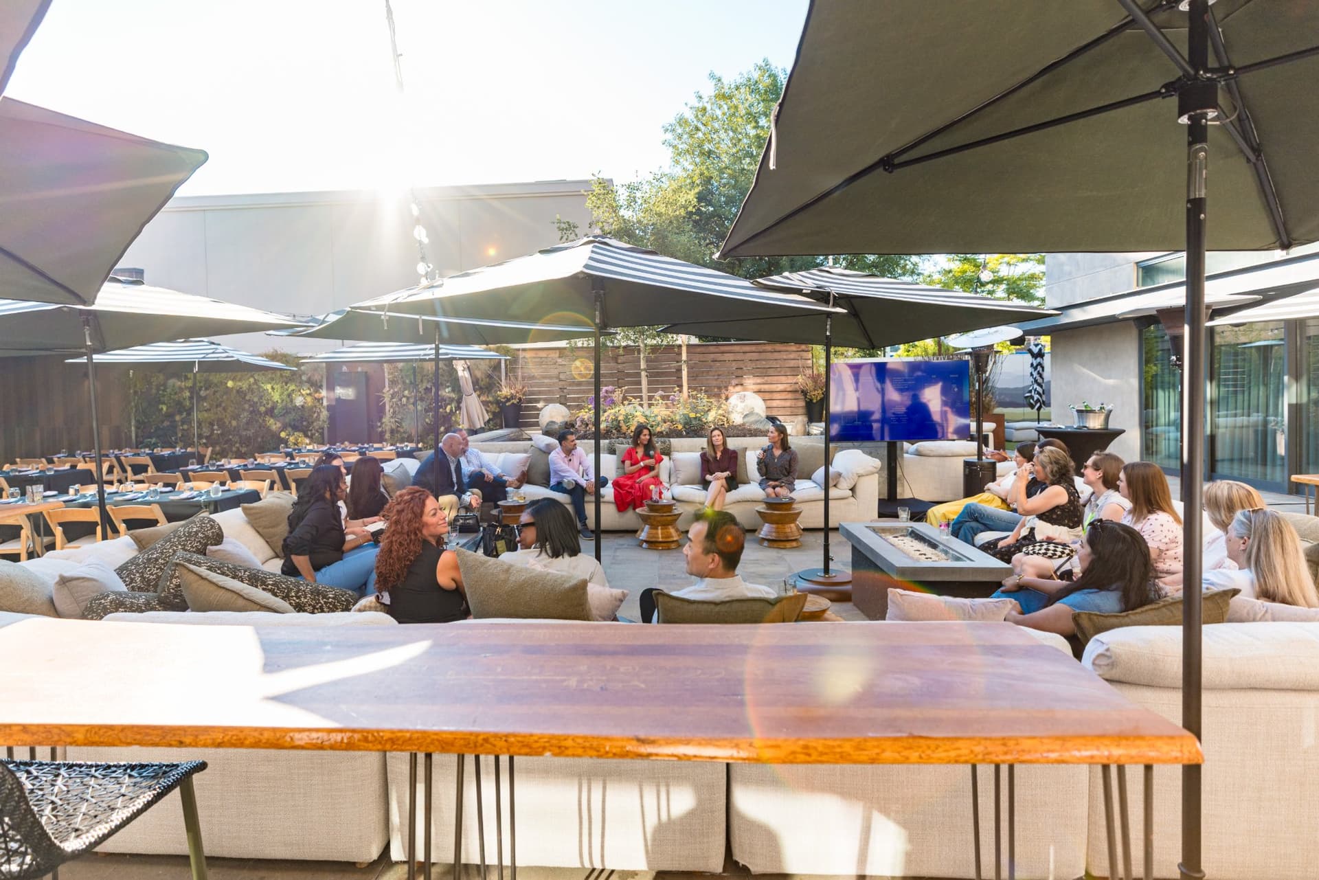 Guests standing together at the high-top tables during the Magnus reception in Palo Alto