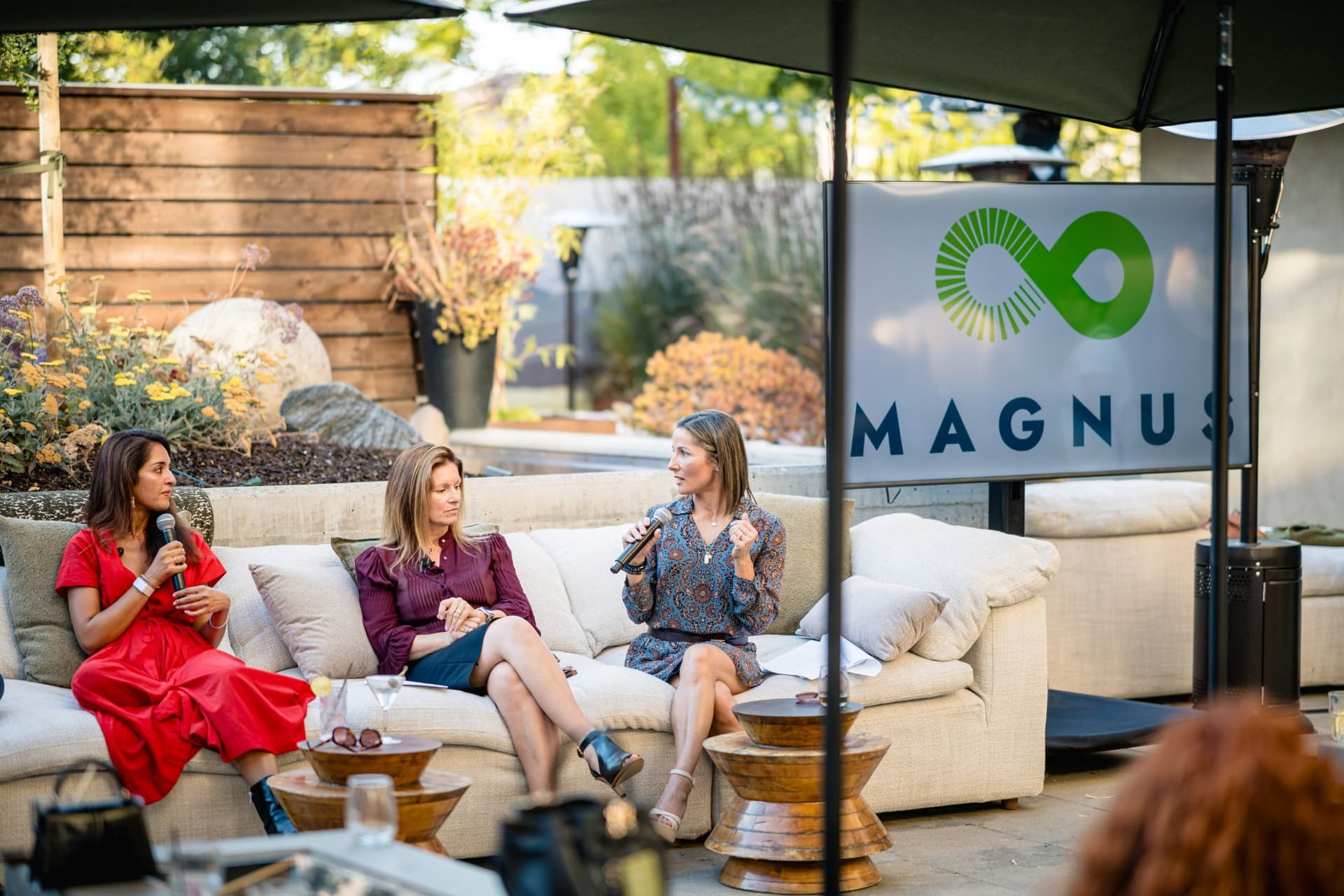 Guests seated around the lounge area listening to the Magnus fireside chat panel in Palo Alto