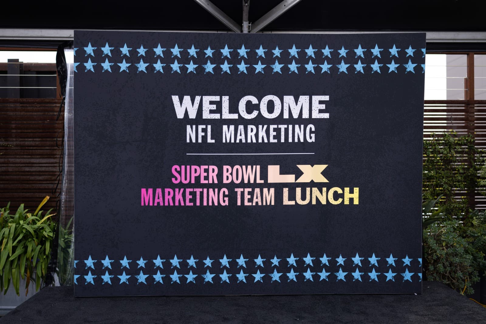 Vibrant atmosphere at NFL Super Bowl LX marketing lunch at The Pearl SF San Francisco Bay Area by JY Studio